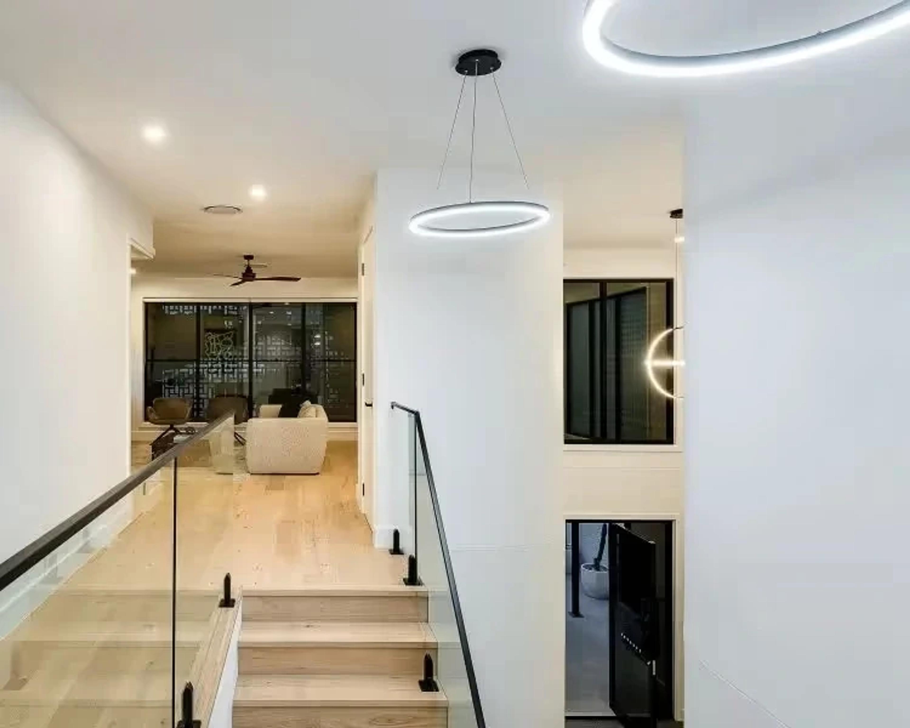 Upper landing with circular pendant light and void
