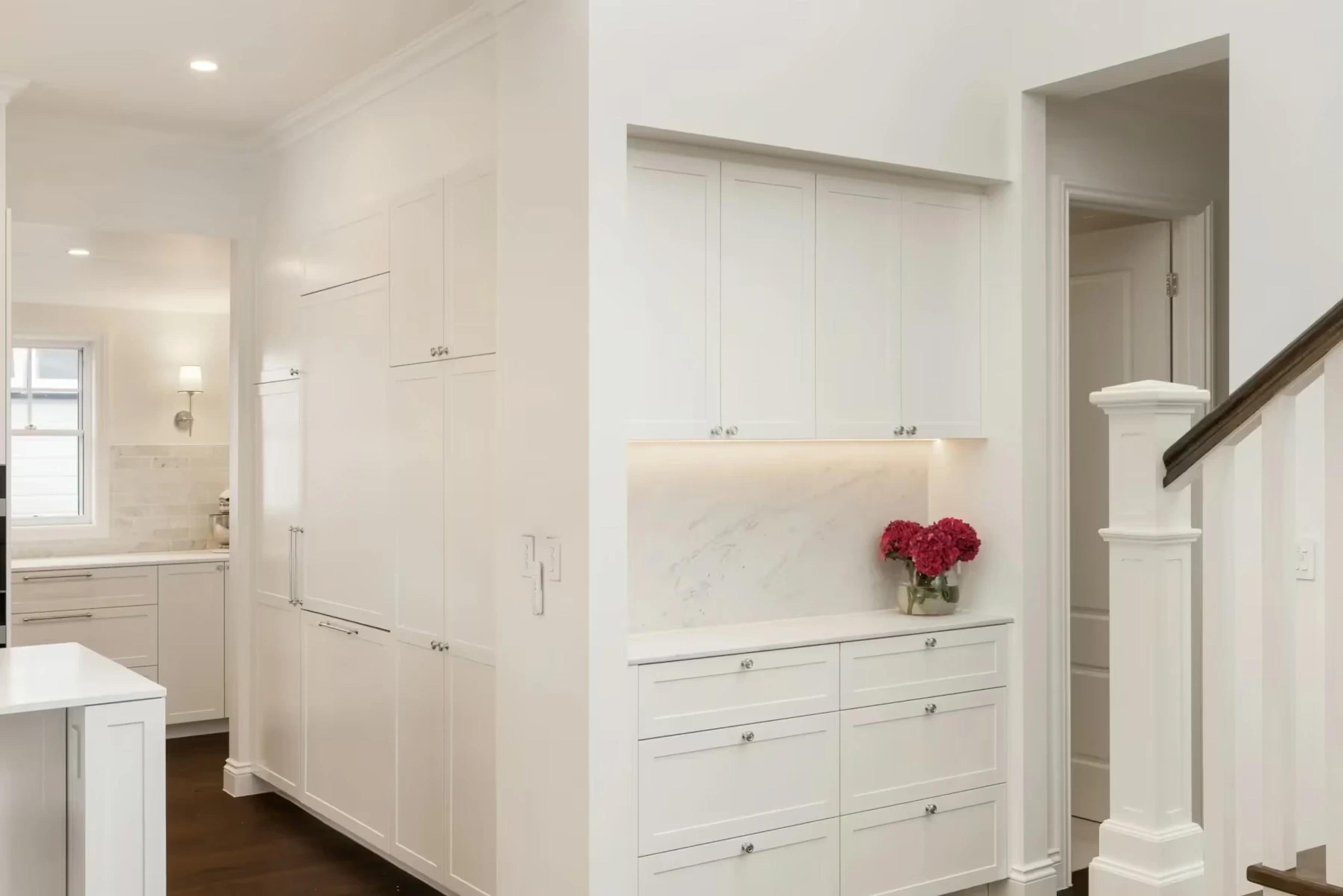 White butler pantry and joinery beside timber staircase