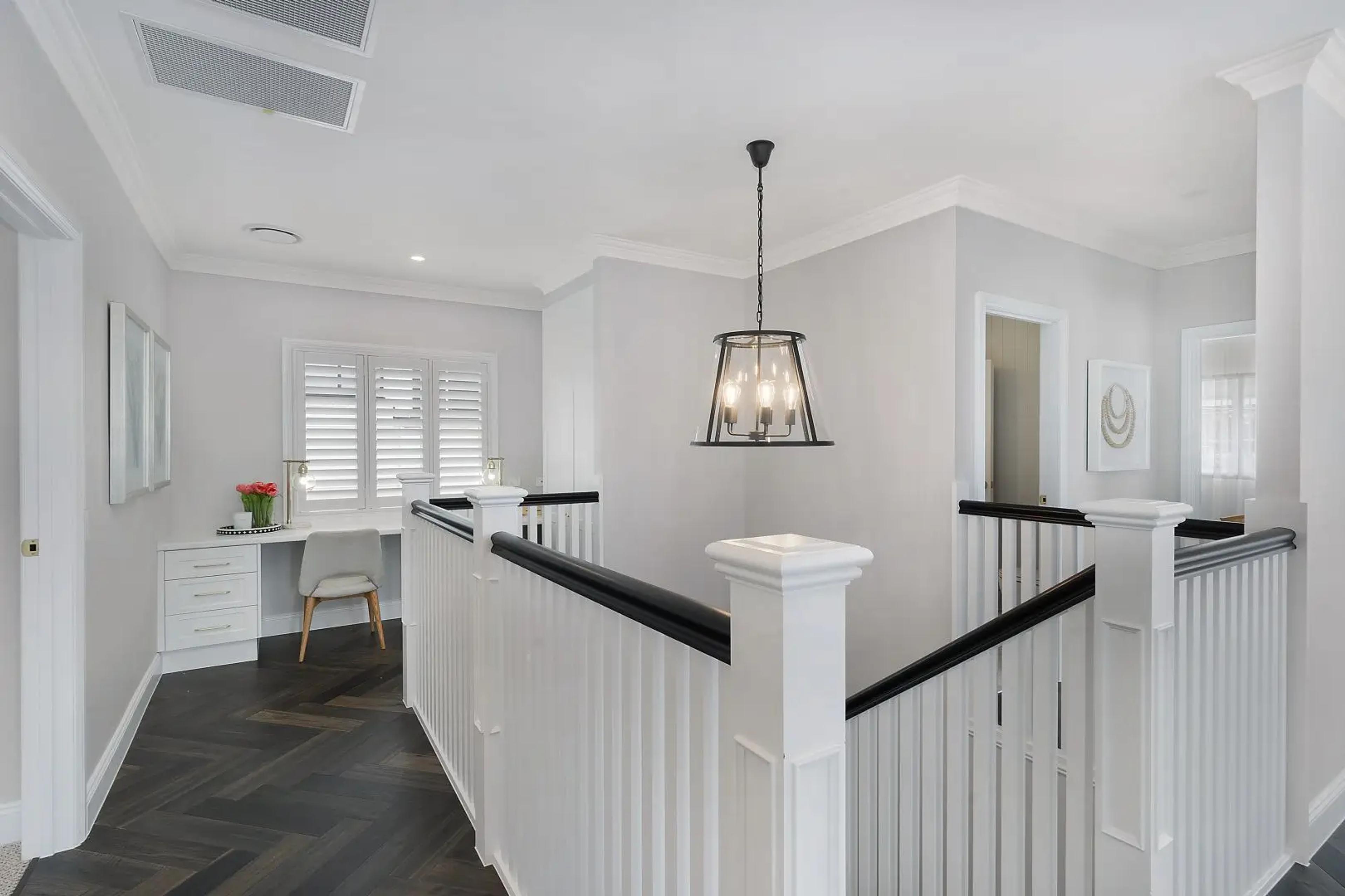 Upstairs landing with study nook and pendant light