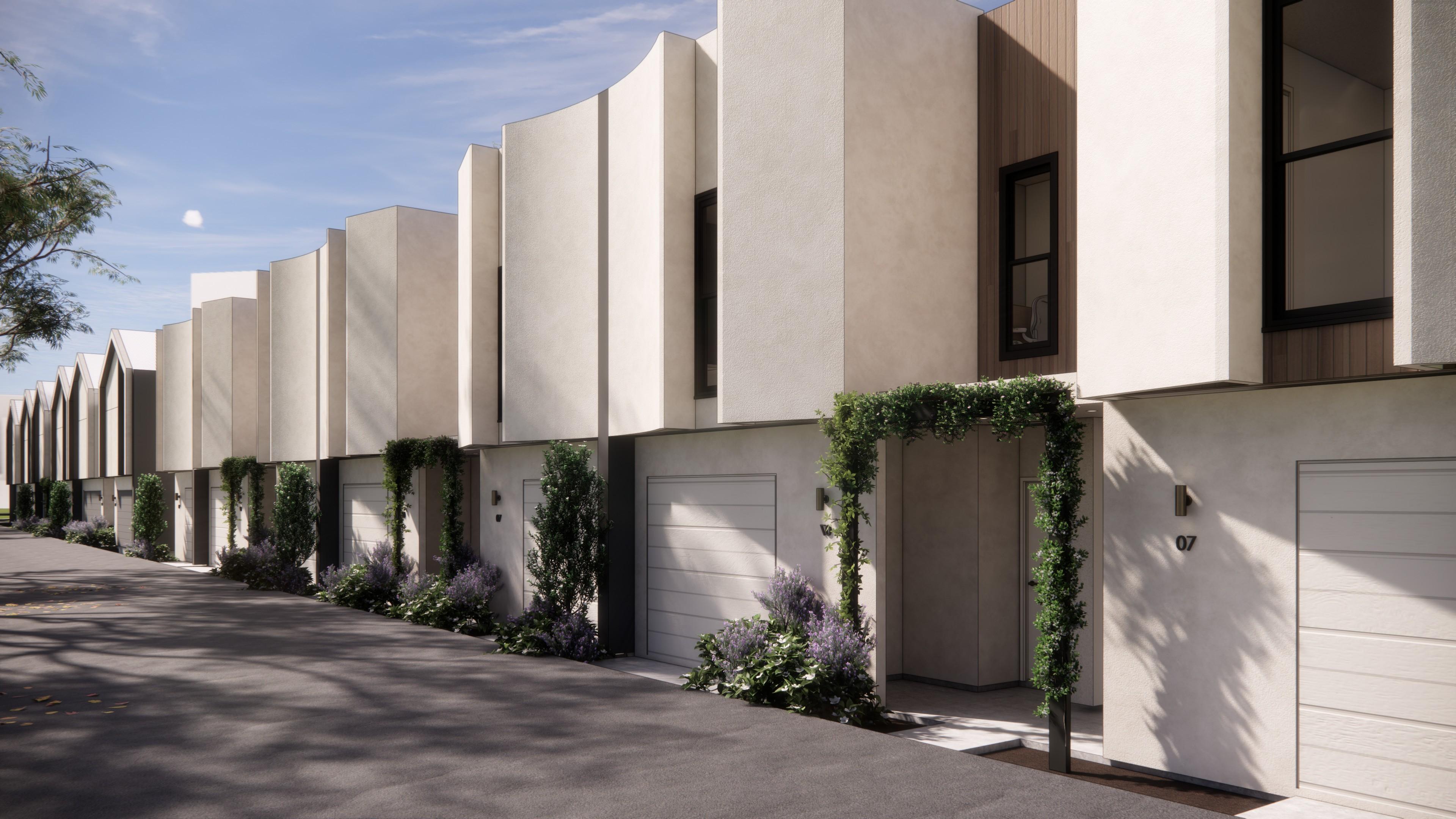 Row of curved parapet townhouses along laneway
