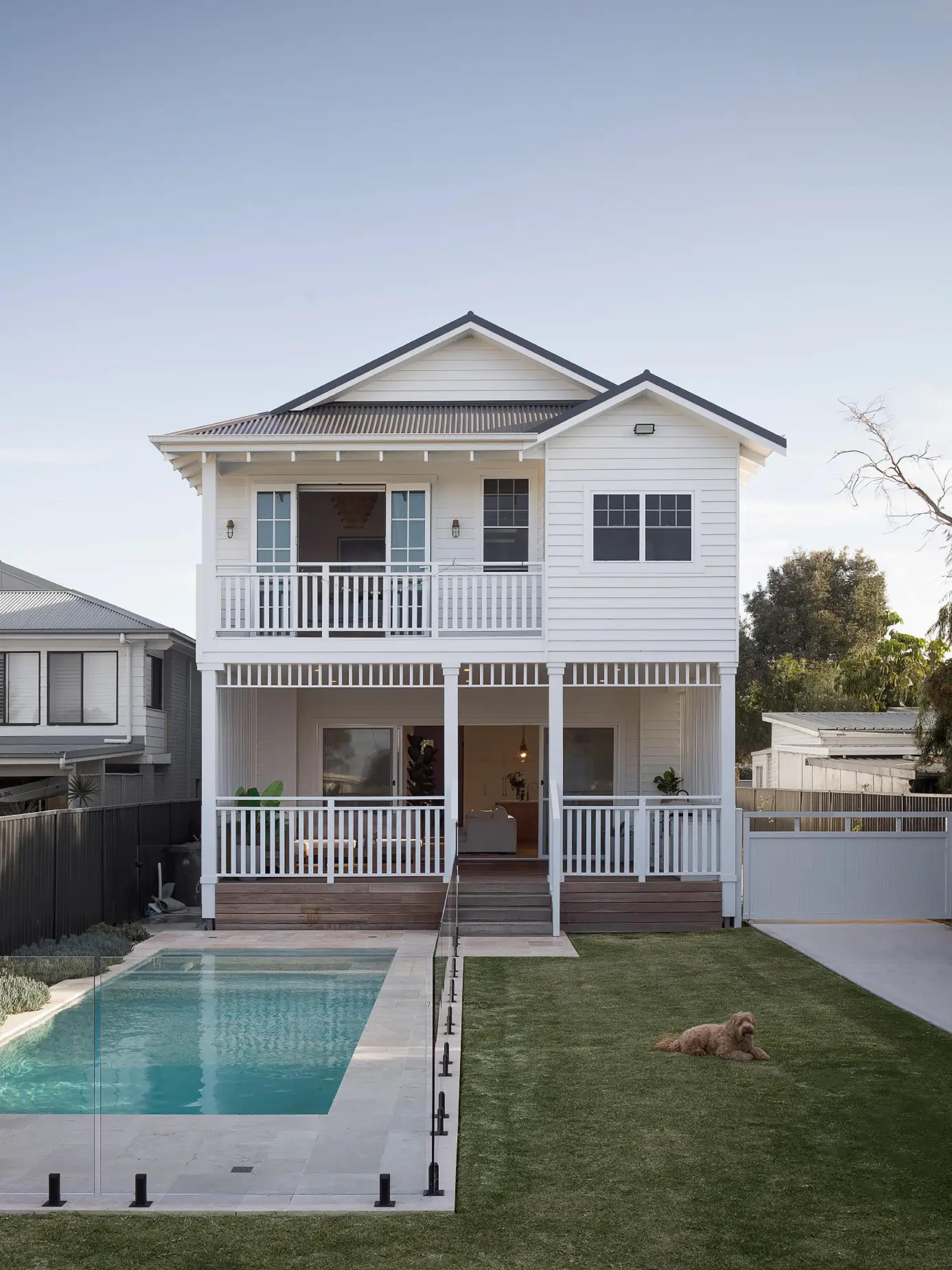Rear of the home with covered verandah, pool and lawn