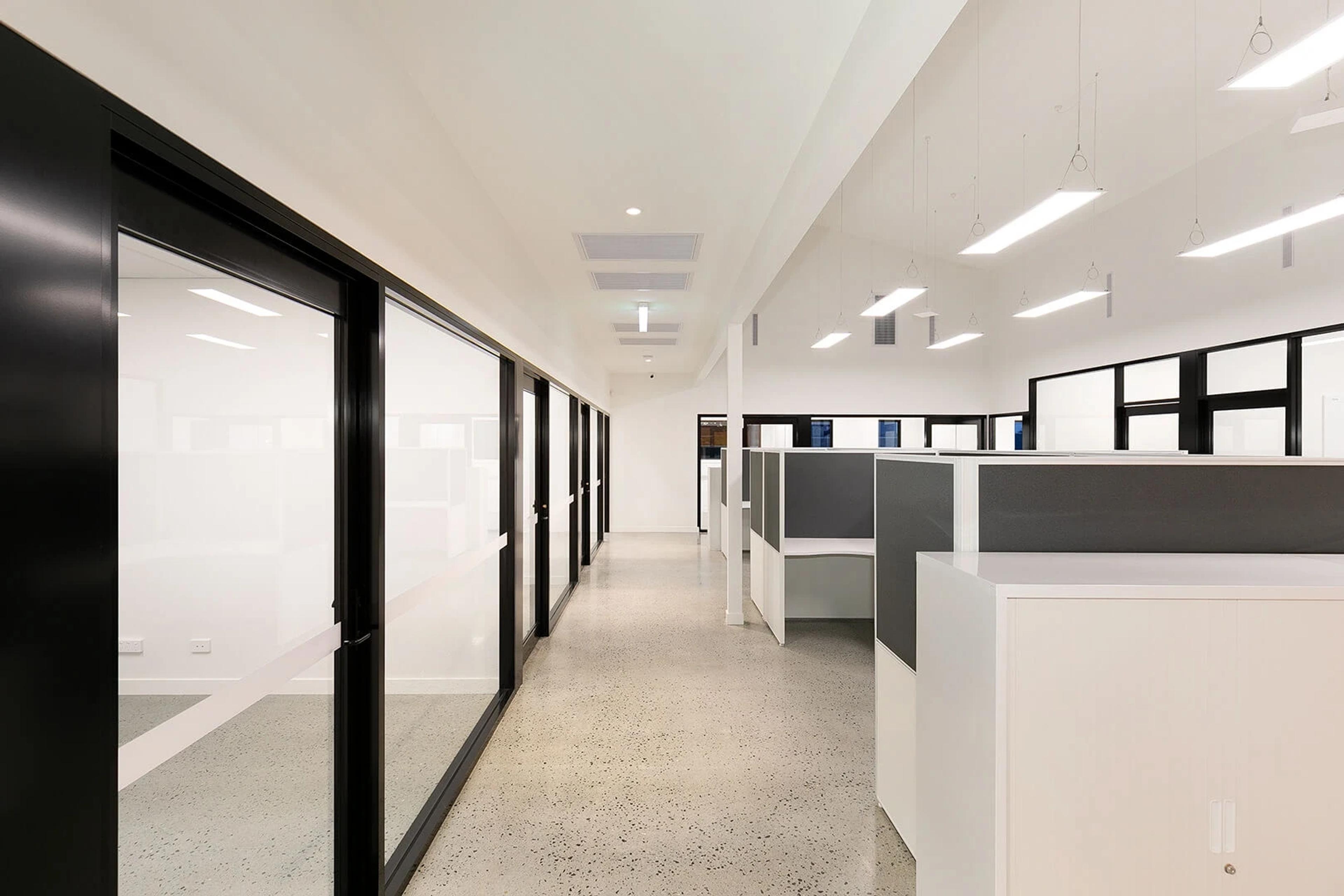 Open plan office with cubicle workstations and clerestory windows