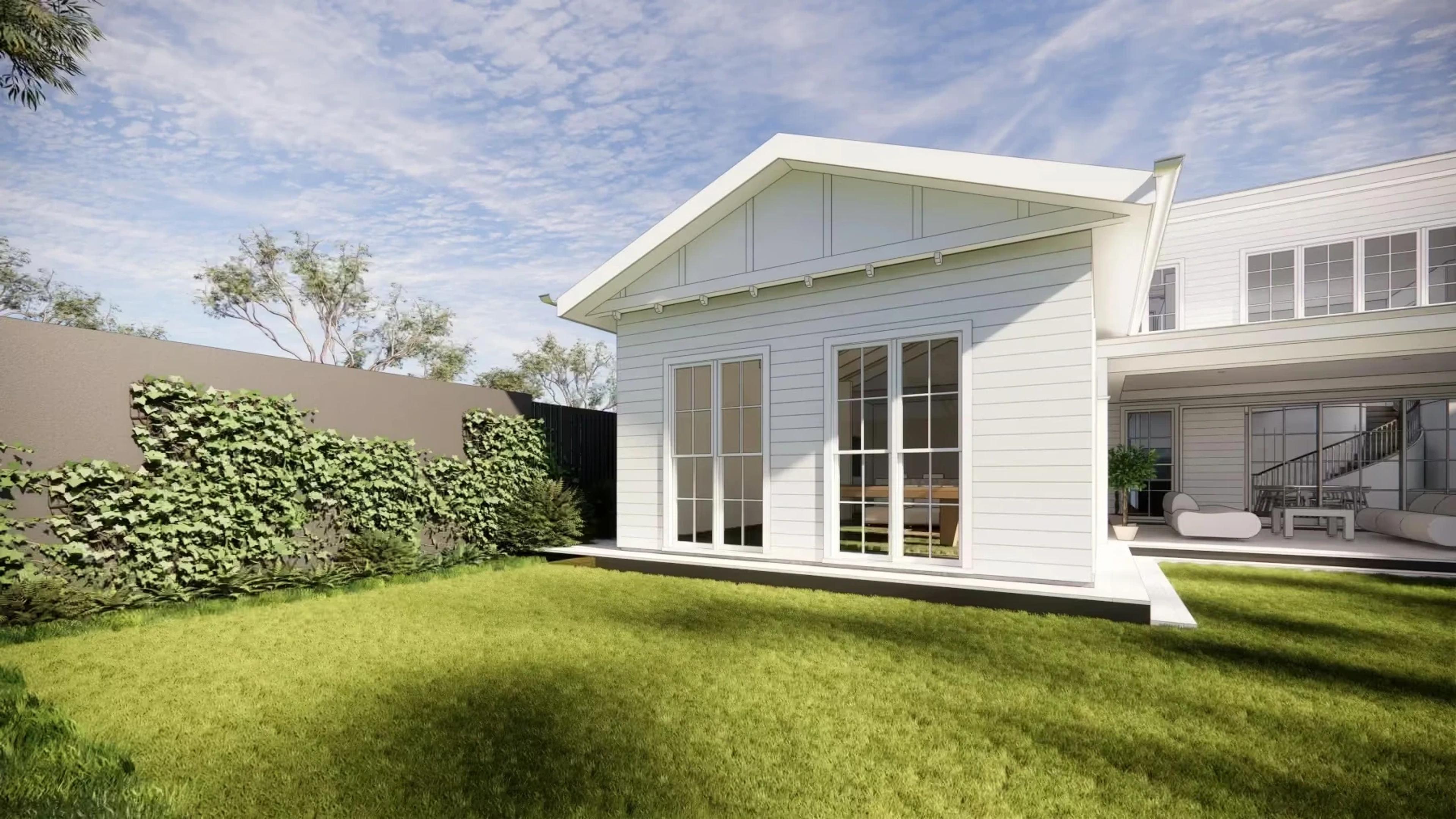 Rear garden studio pavilion with glass doors and lawn