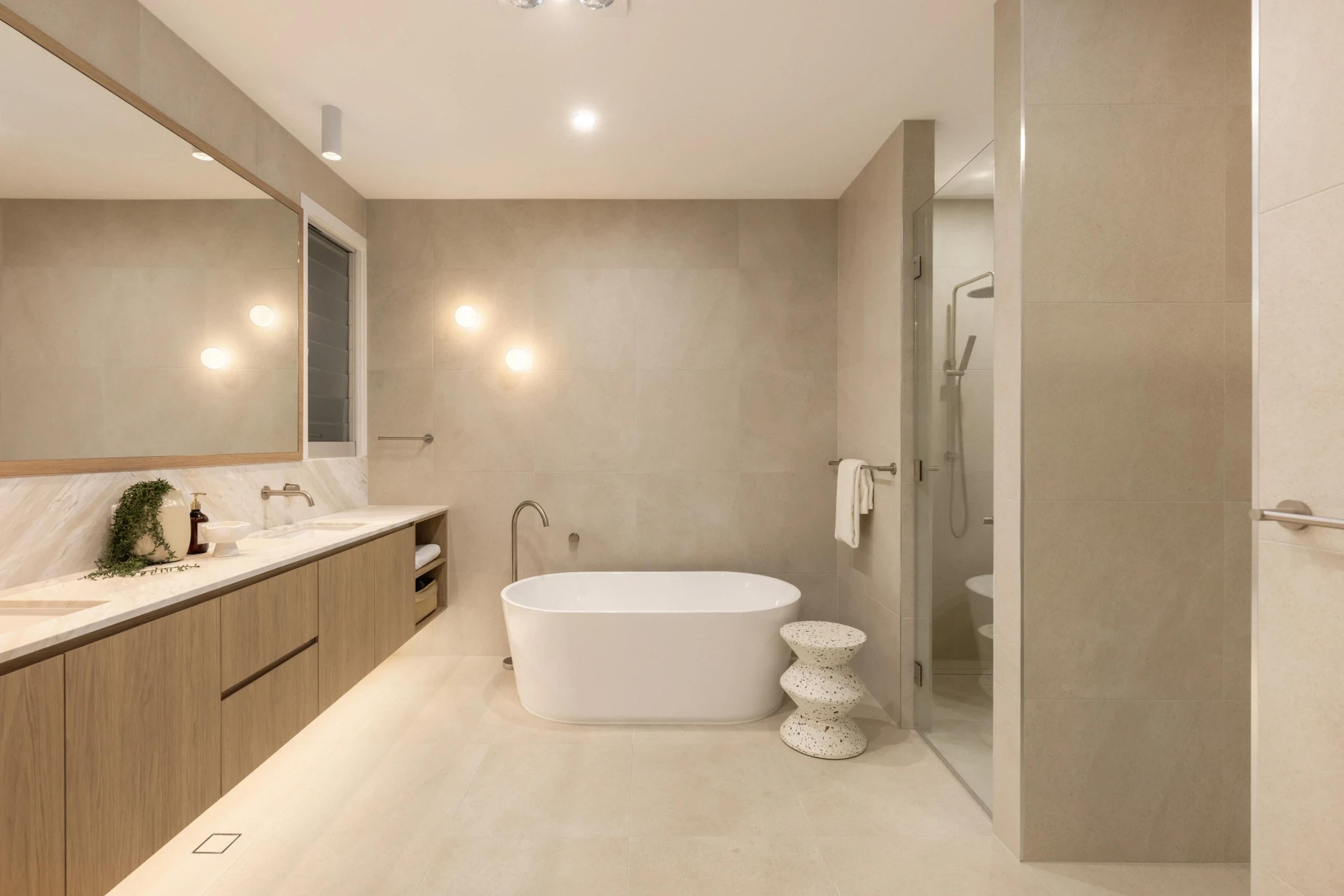 Modern ensuite bathroom with freestanding tub and timber vanity