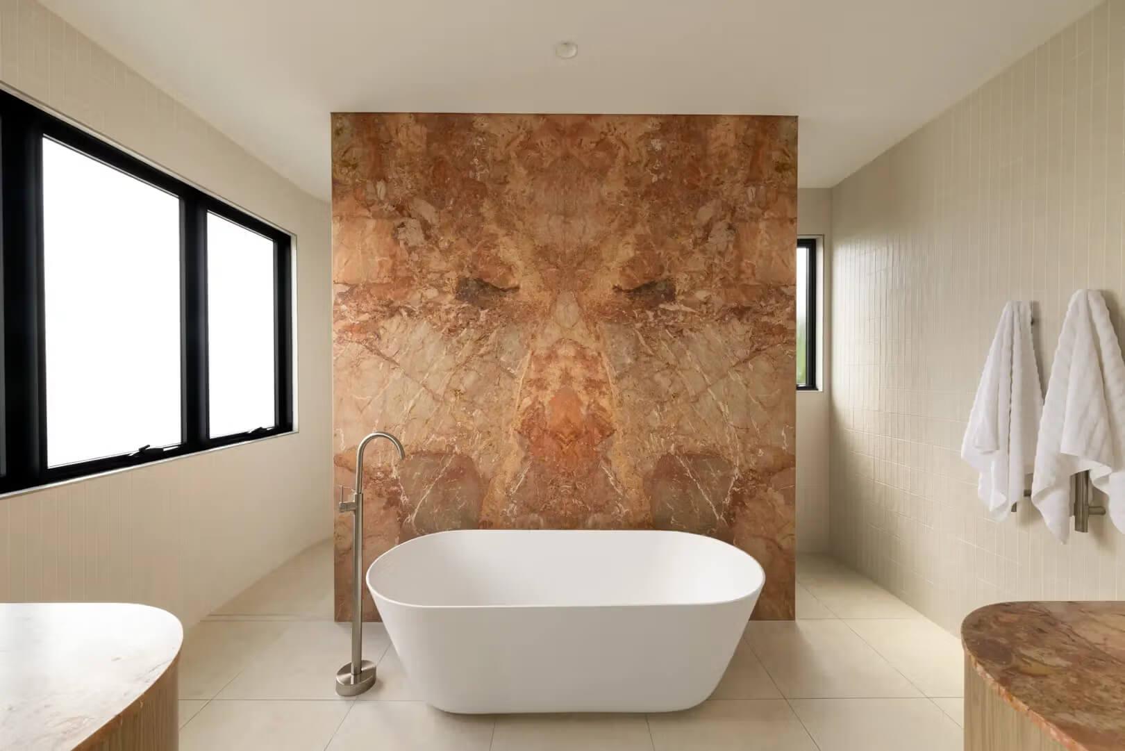 Luxury bathroom with freestanding bath, stone feature wall and natural light, Prelude in Bulimba, by Invilla Architecture
