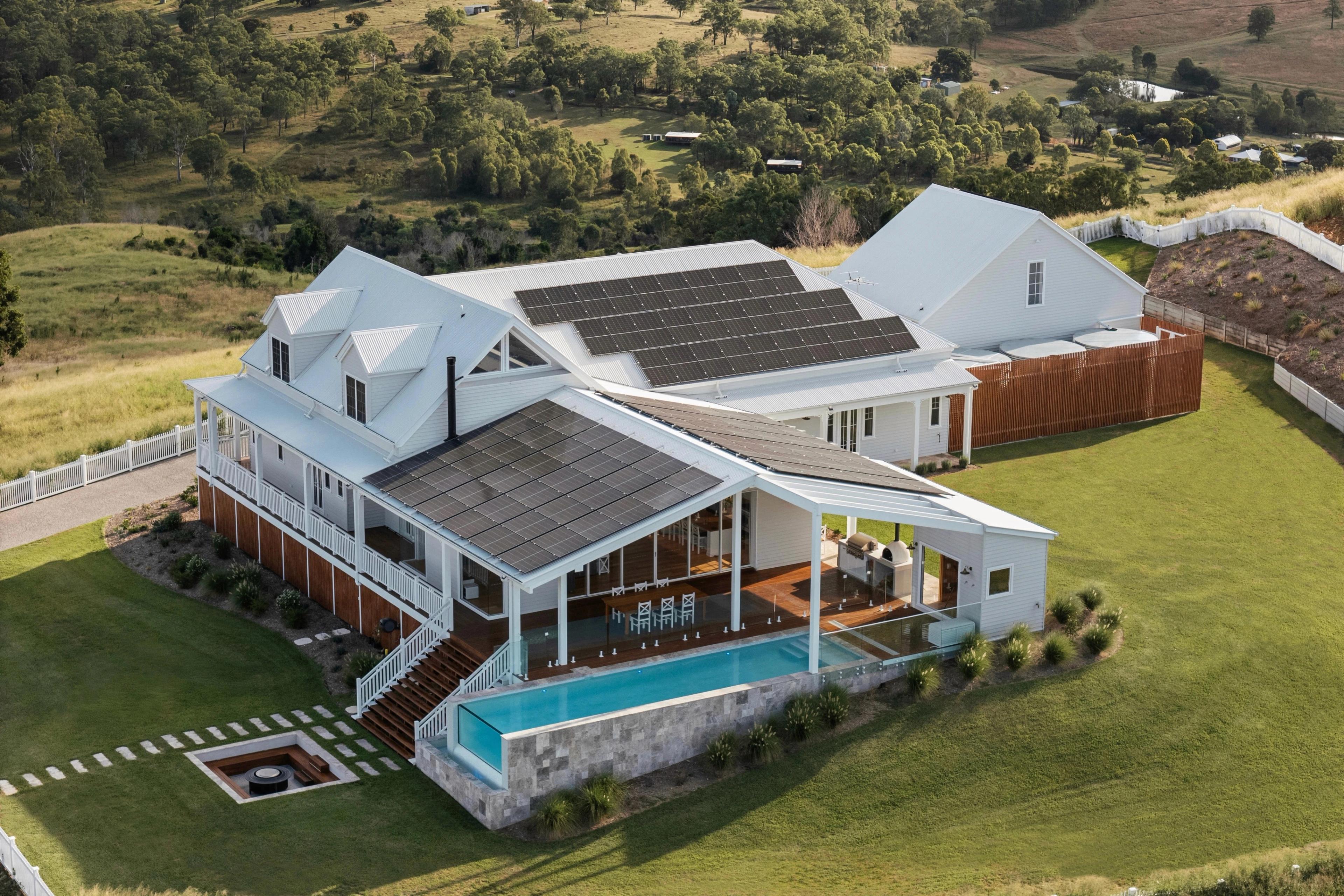 Aerial view of homestead with pool, verandah and solar panels