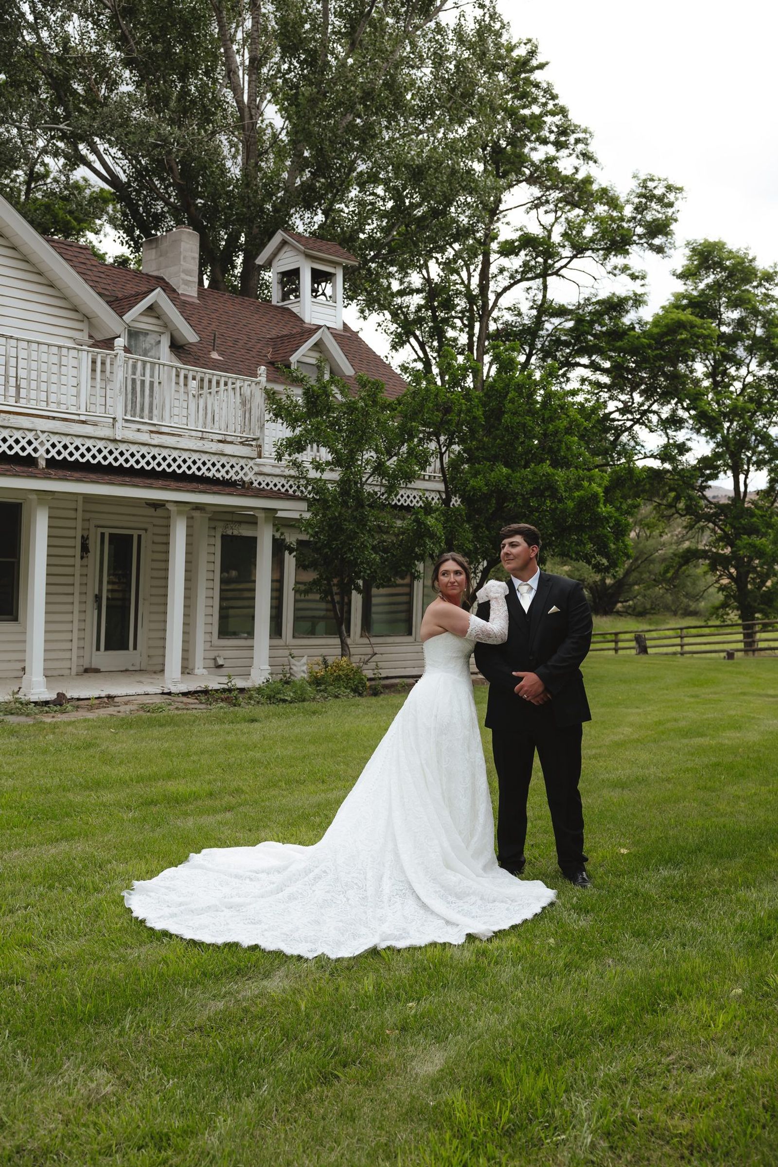 Couple on the lawn in front of the house