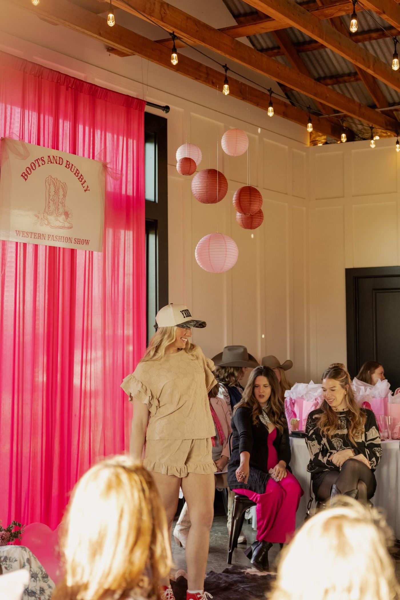 A model walking the runway at Boots and Bubbly
