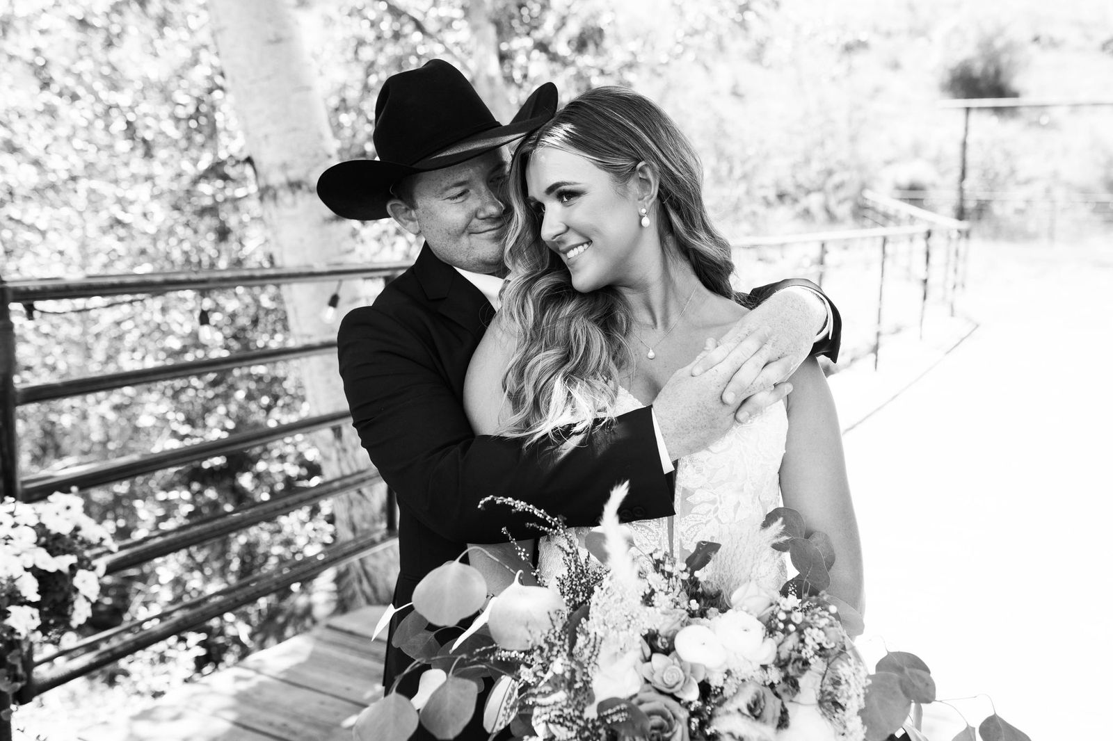 Black and white portrait of a couple in a cowboy hat