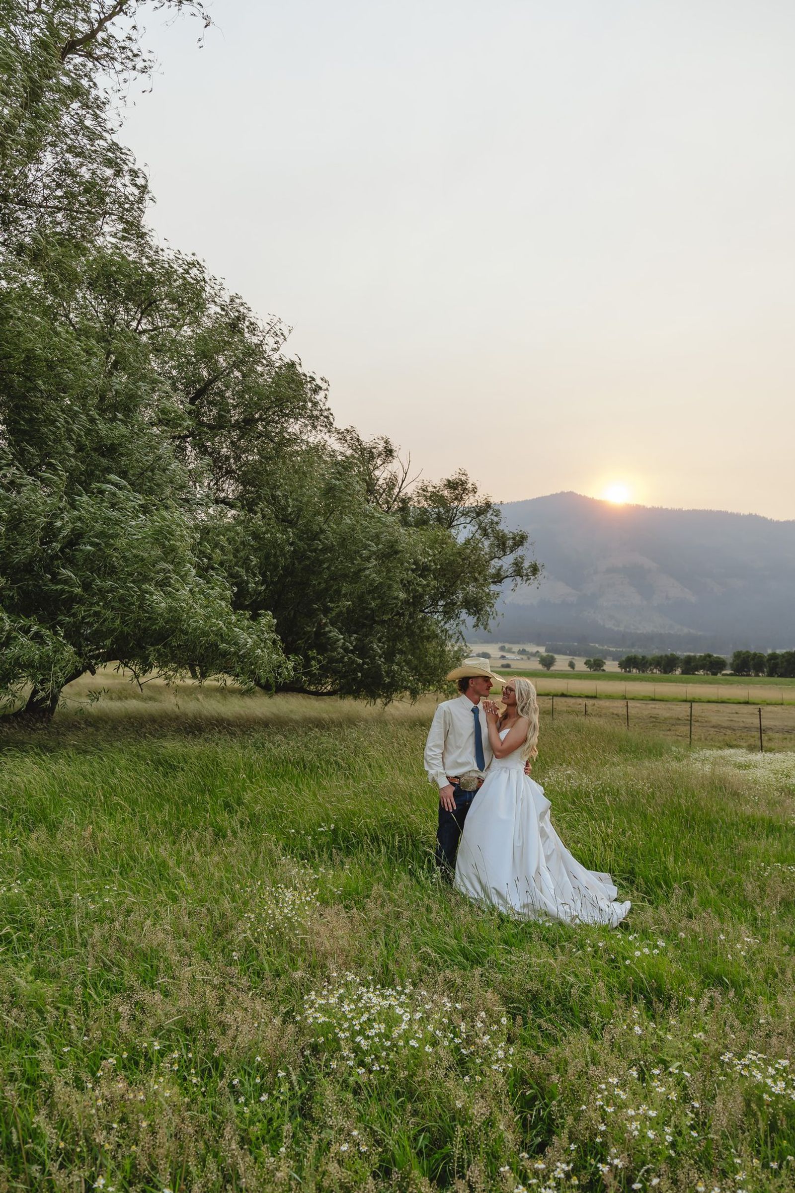Couple in the orchard at sunset