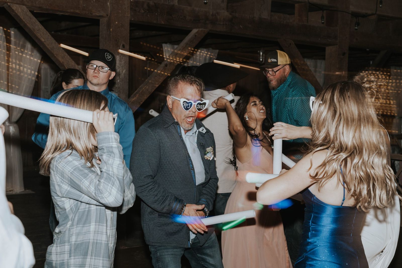 Guests dancing and celebrating at the reception