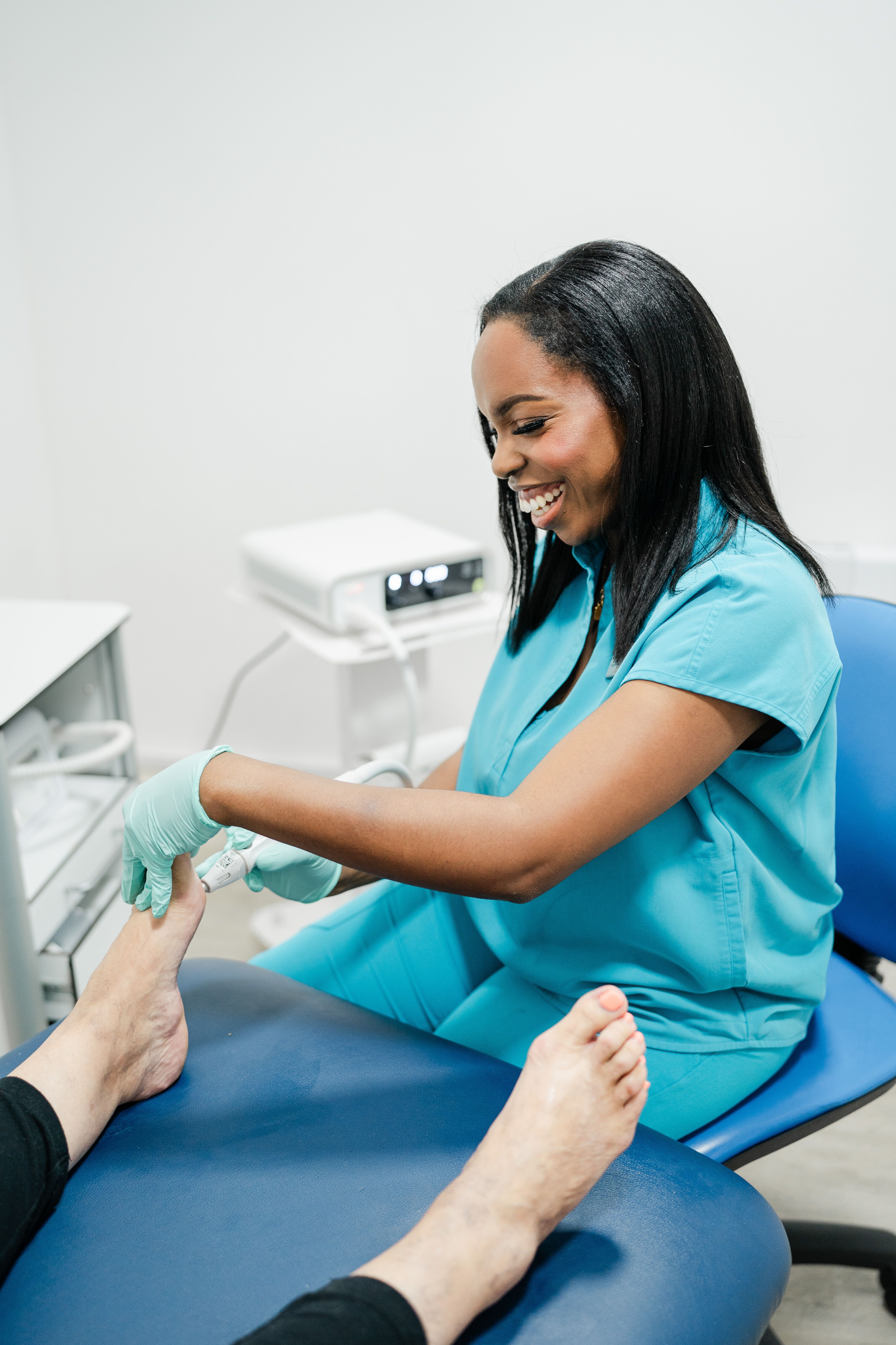 Friendly podiatrist welcoming a patient at Chiltern Wellbeing reception