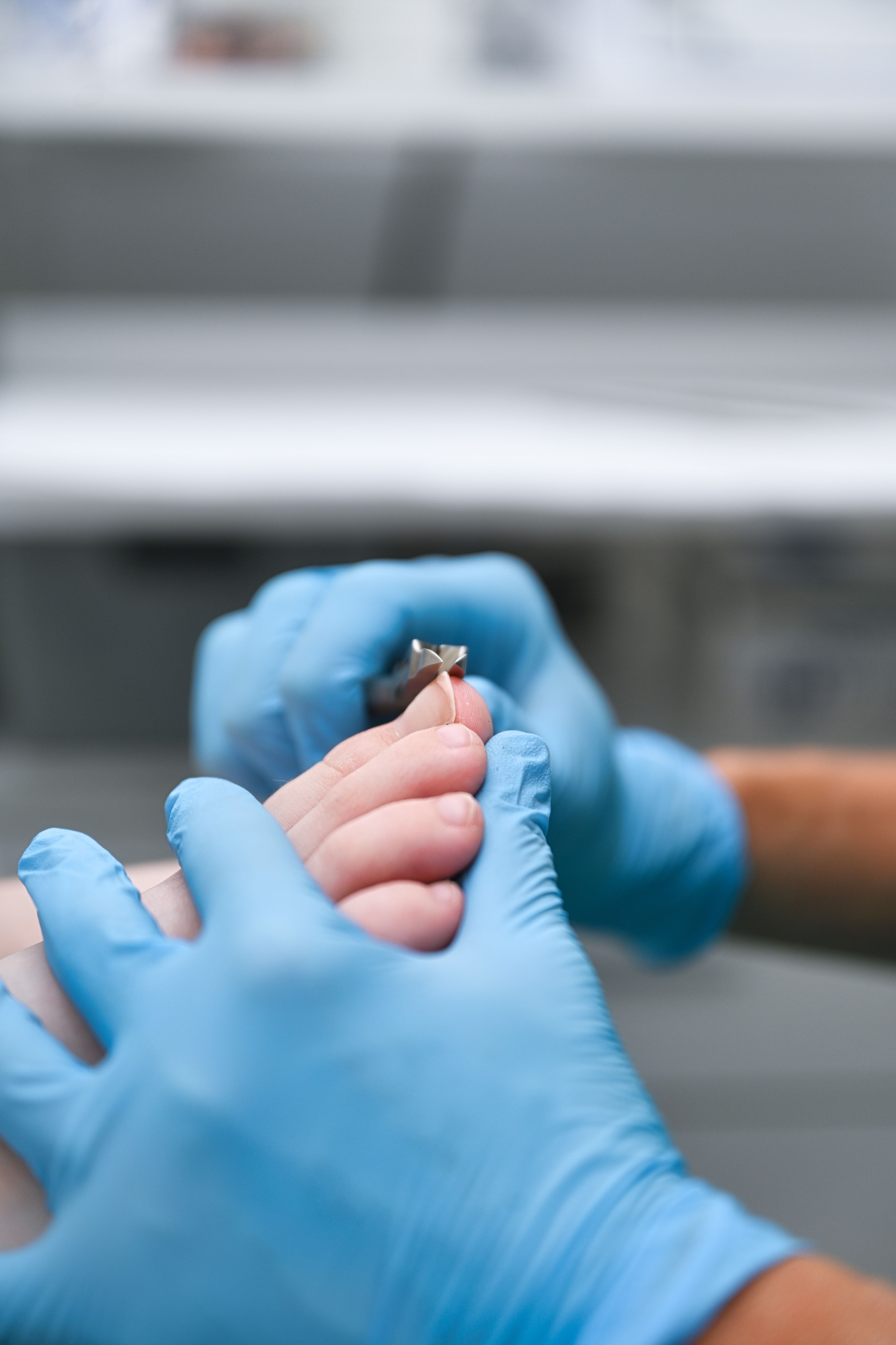 Podiatrist Clinician Cutting toe nails