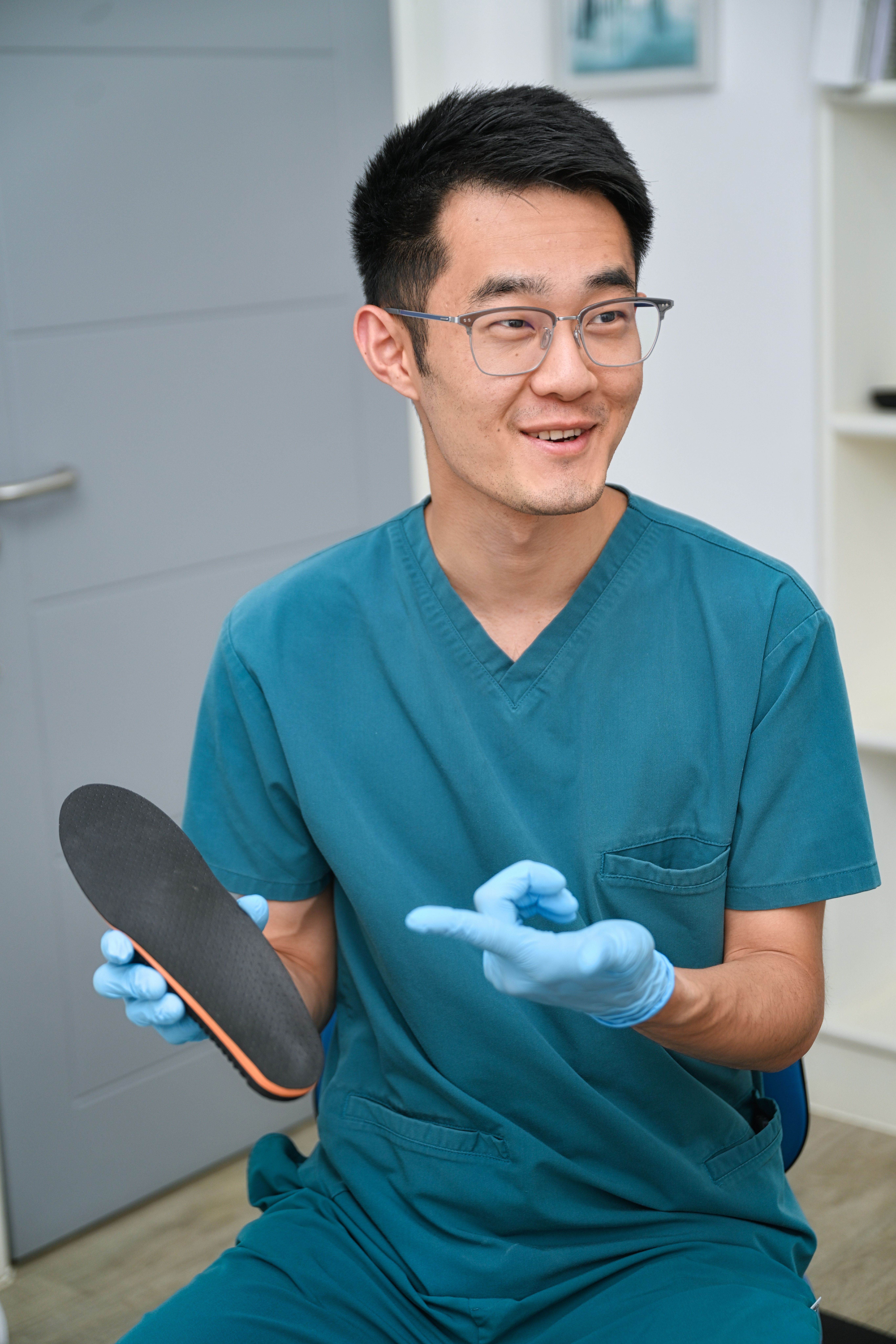 Podiatrist Holding an Orthotic Insole