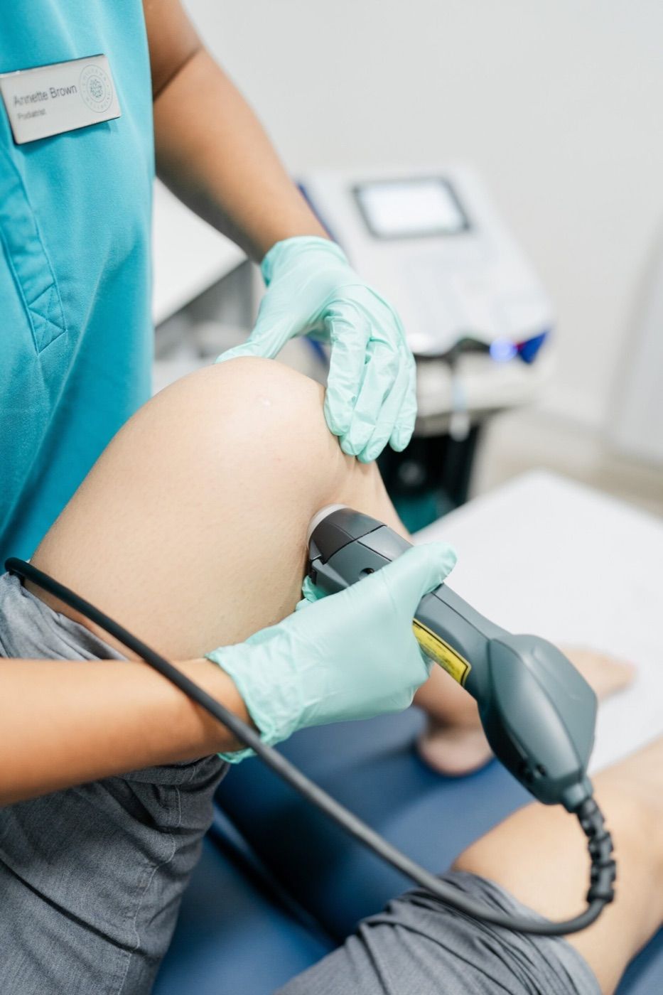 Clinician preparing laser therapy treatment