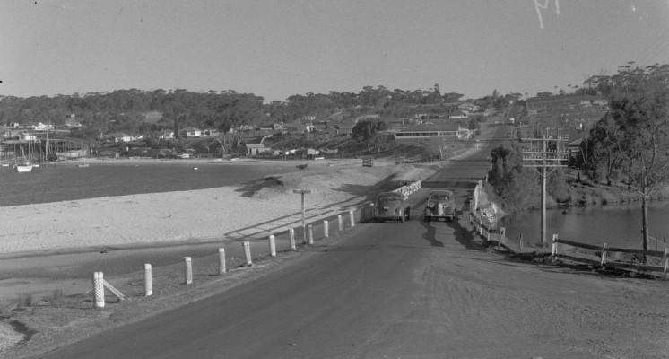 A road crosses between and inlet and a waterway