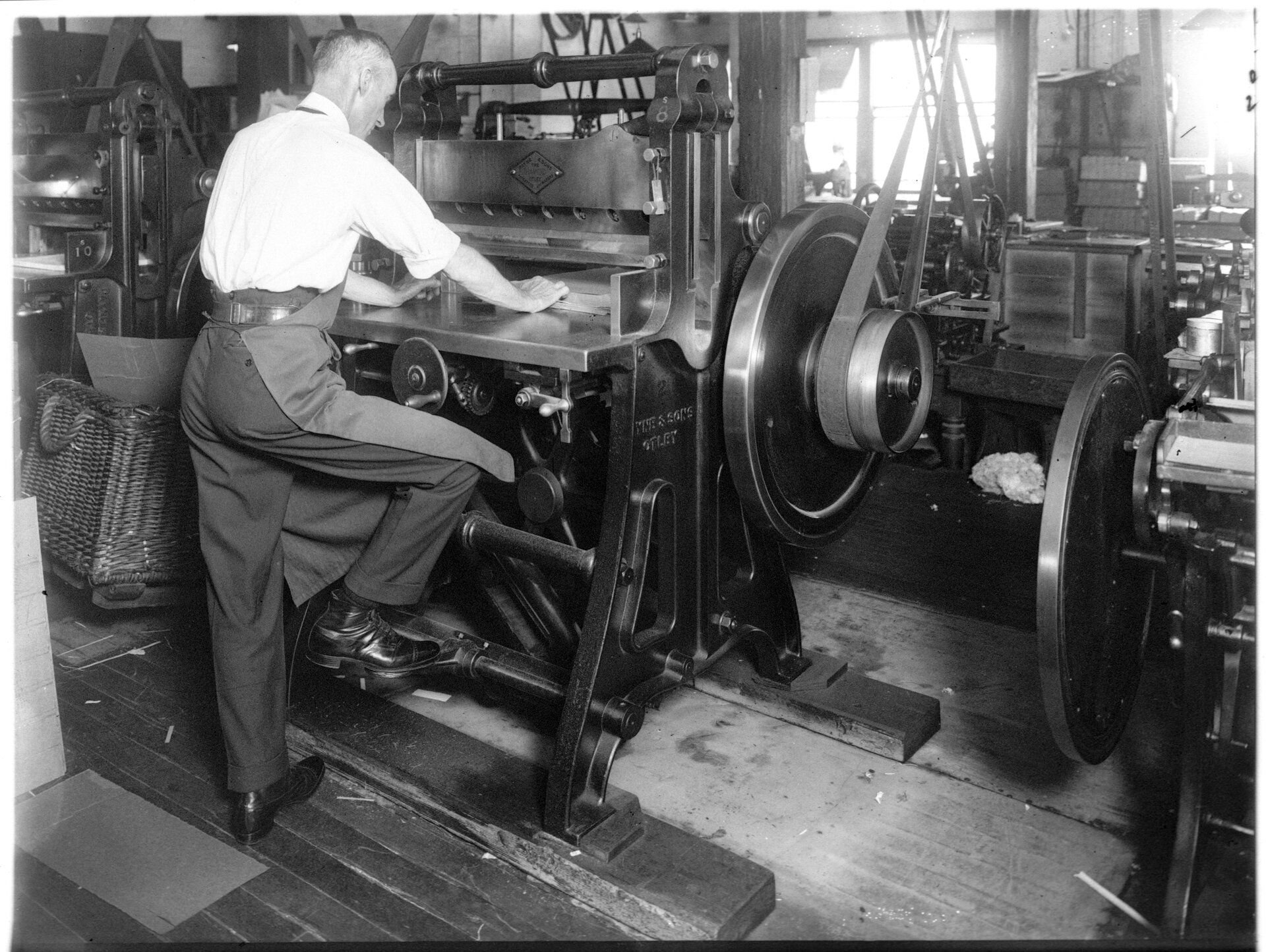 A man working machinery in a workshop