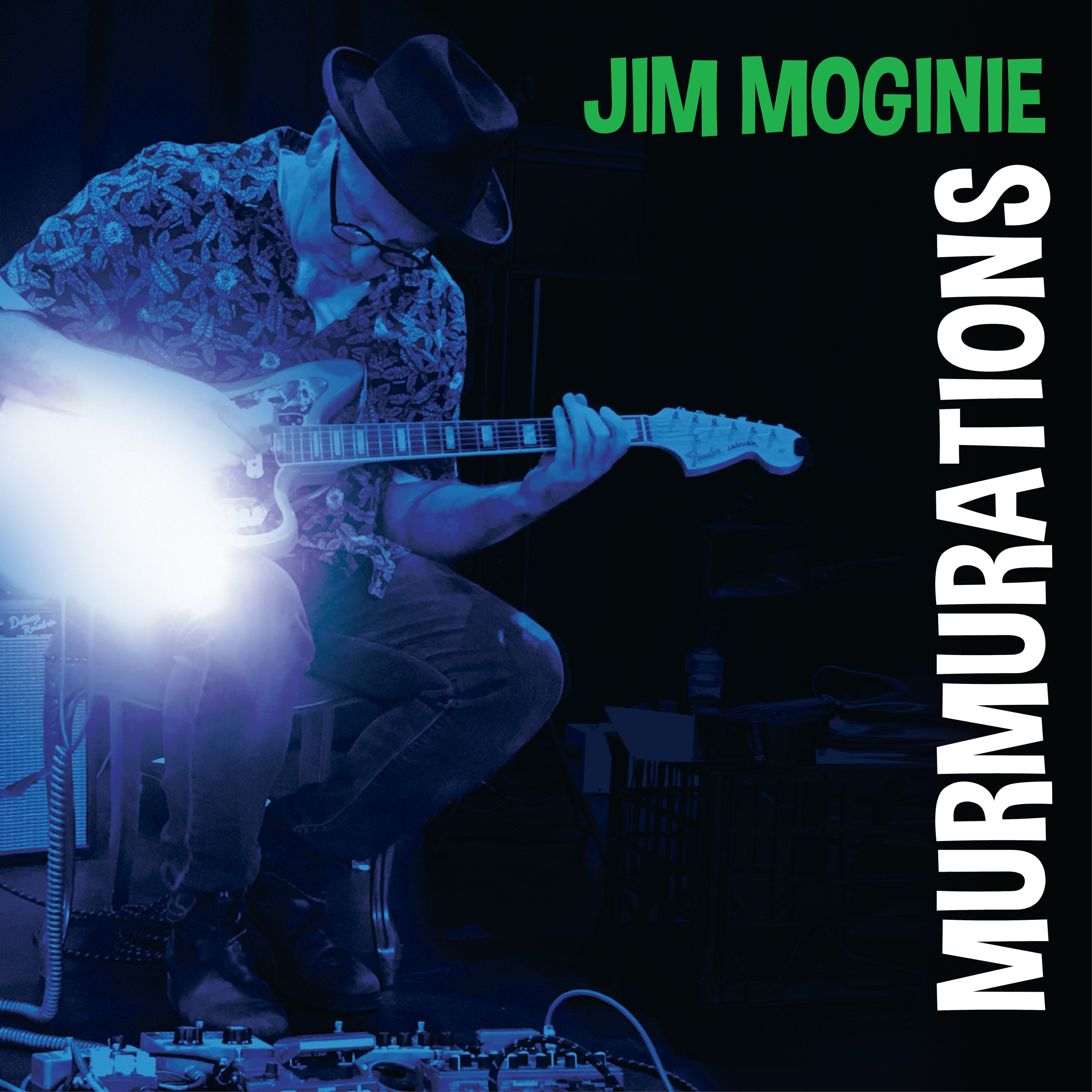 Jim Moginie plays an electric guitar