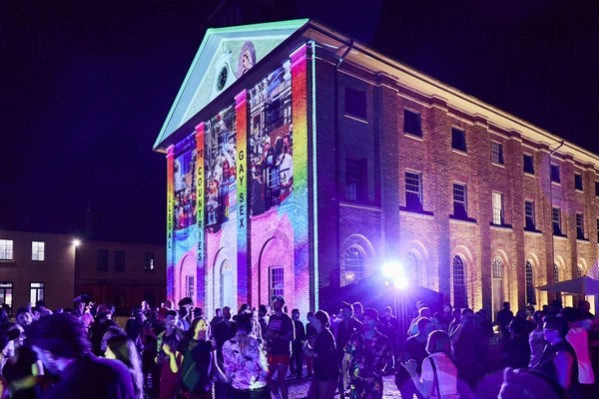 The facade of the Hyde Park Barracks featuring 'Love that dares', a projected artwork by Jacqui North.