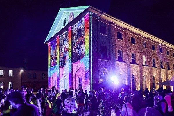 The facade of the Hyde Park Barracks featuring 'Love that dares', a projected artwork by Jacqui North.