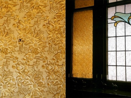 Figured rolled glass, in a building in Victoria  Figured rolled glass, 'Flannel flower' design, as a length of sheet glass and as part of a leadlight design insitu in a building in Victoria.  Figured rolled patterns were often installed in small panels alongside a variety of alternate figured rolled glass of different designs or the same design in an alternate colourway. By the end of the 19th century, entrance doorways of Australian bungalows together with their transoms and sidelights were often adorned with decorative architectural glass and the type of glass used was commonly a mix of stained glass, leadlight, etched glass and figured rolled glass. By the 1930s, figured rolled glass had largely retreated from the front door to bathrooms and lavatories where its ability to provide light but maintain privacy was valued.  Photo (c) Caroline Simpson Library & Research Collection, Museums of History NSW