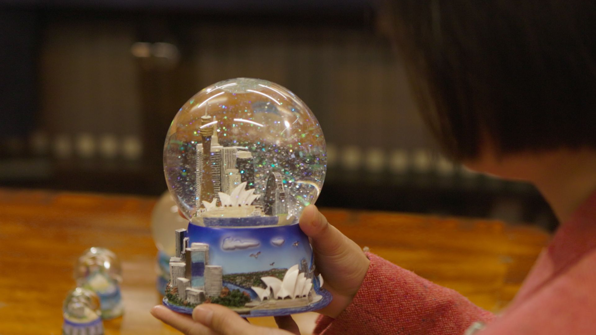 Kim Tao with her snow globe collection at the Caroline Simpson Library