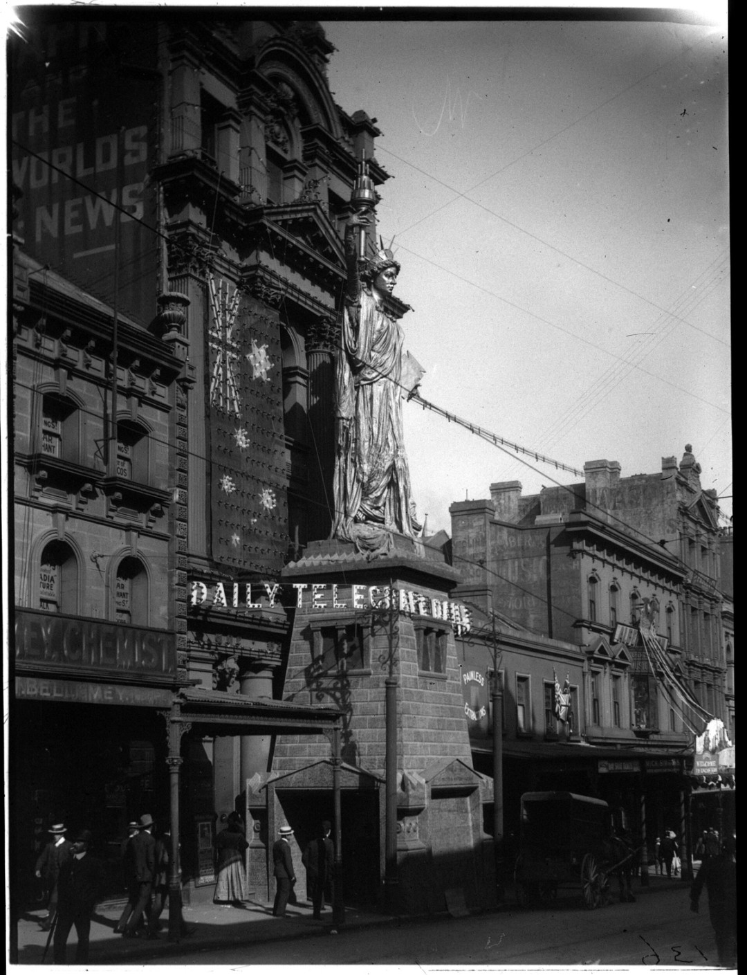 A Statue of Liberty replica in front of the Daily telegraph building