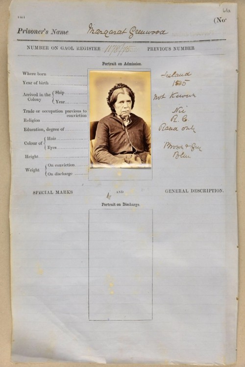 Mug shot of an elderly woman on a gaol entry form