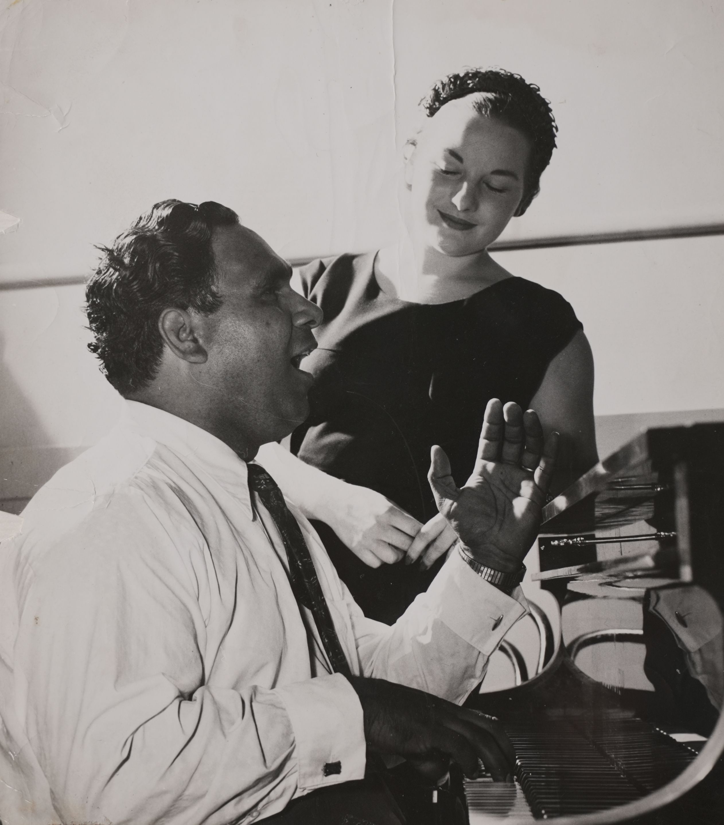 Harold Blair teaching a student at a piano