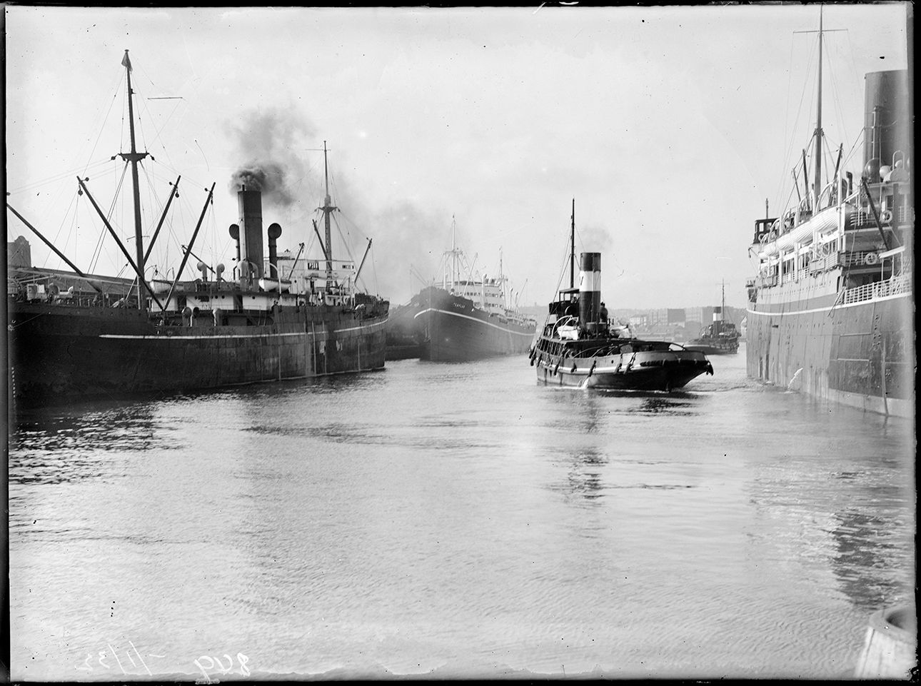 Ship and tugboat in Darling Harbour