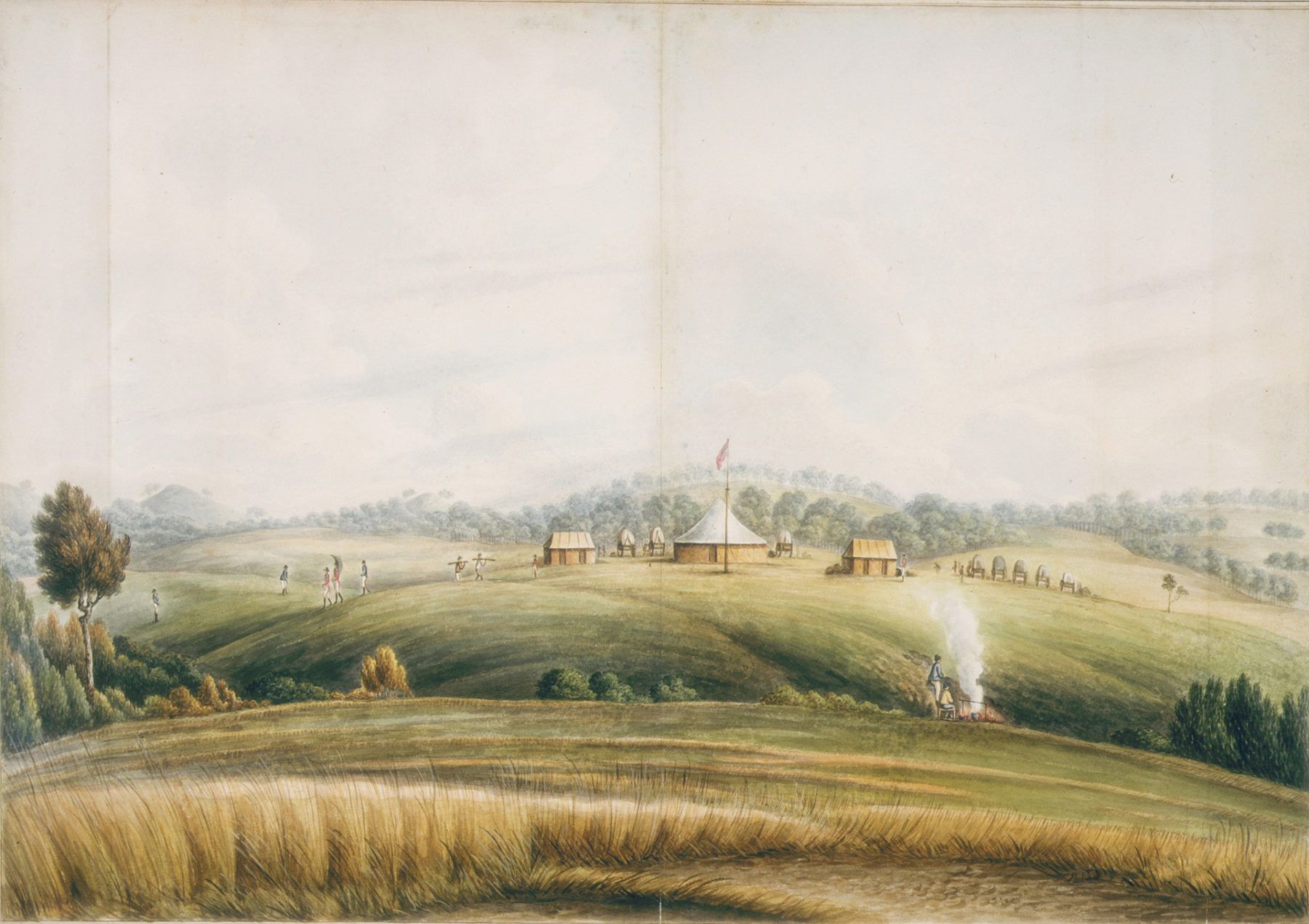 View across cultivated landscape with smoke and farm buildings in distance.