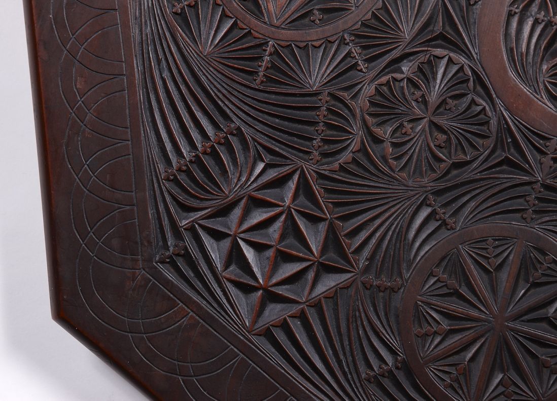 Table top detail  Detail of chip-carving on an occasional table, made by carpenter George Stevenson Liggins (1874 -1907), Melbourne, c1902. 80(h) x 59(w) x 59cm(d).  The workmanship demonstrates an accomplished level of technical skill developed by a professional, the detail in these table tops showing a knowledge of geometry and skill with rulers, set squares and compass.  Caroline Simpson Library & Research Collection, Photograph © Sydney Living Museums. Gift of Frederick and Margaret Liggins. [L2010/41]