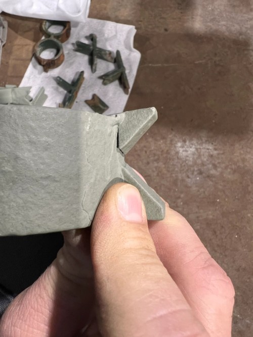 Hand holding an interesting metal shape