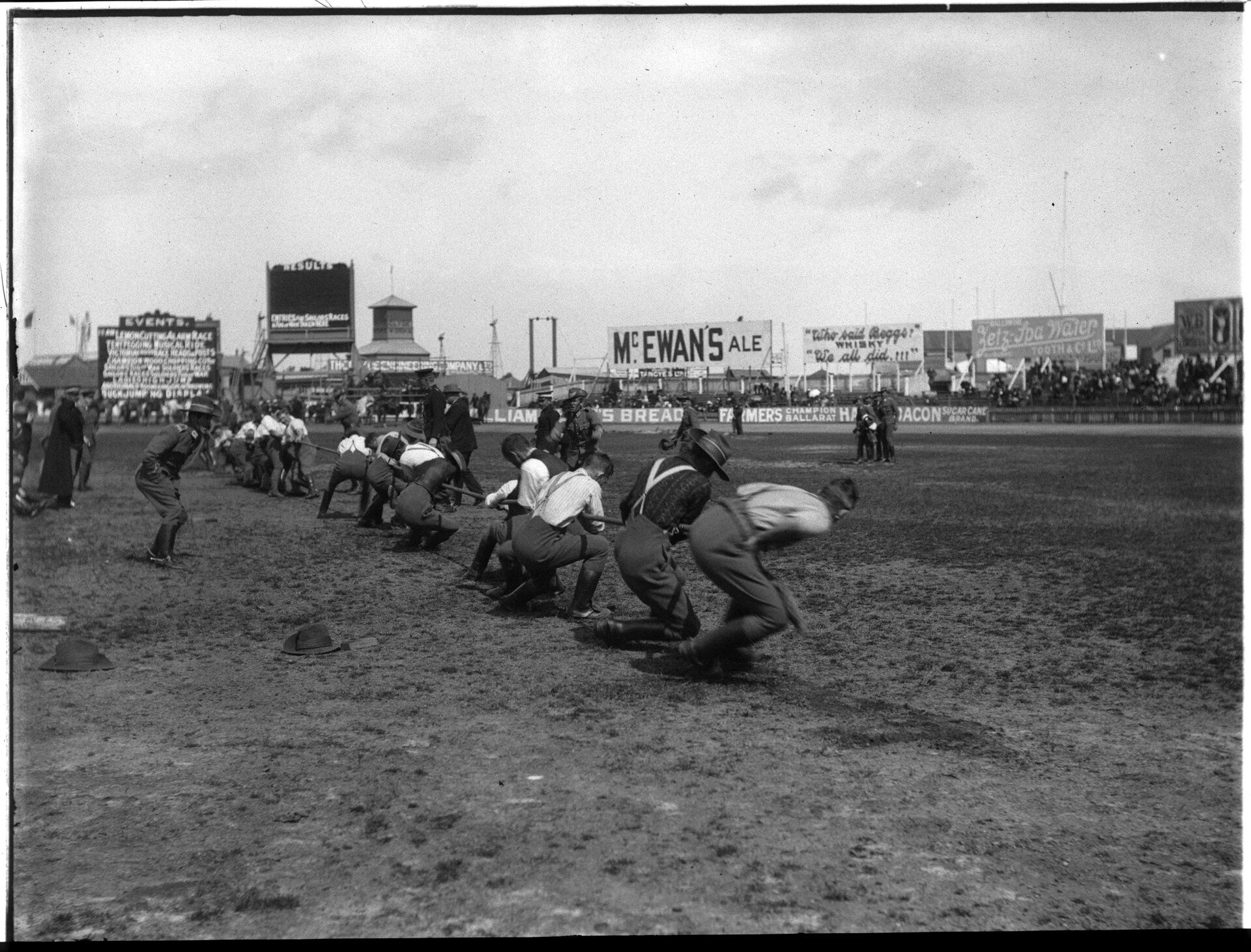 Men playing tug-o-war on a field