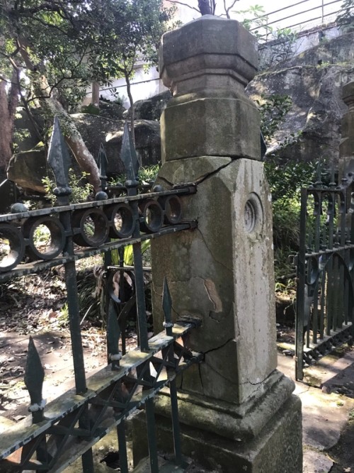 Sandstone column and wrought iron fence