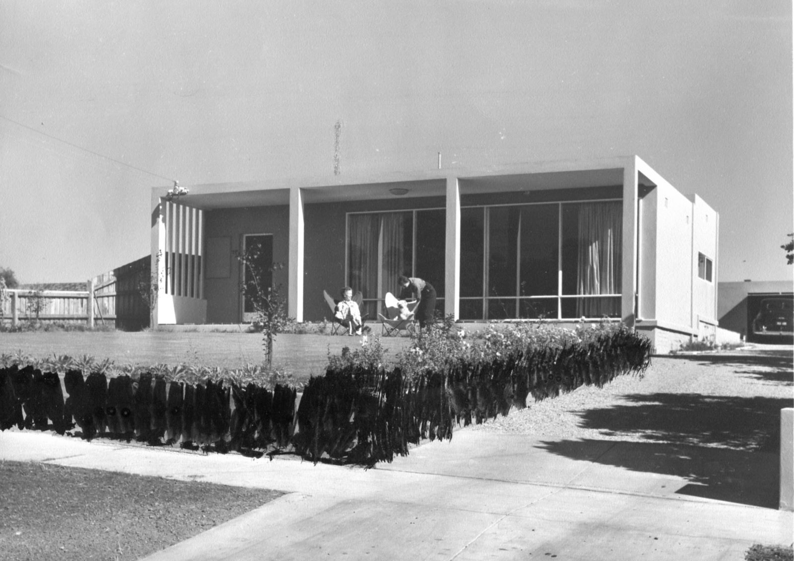 A concrete house on Belford Road, Kew, Melbourne, designed by John and Phyllis Murphy and still standing. John has blacked out the fence in this 1955 photo