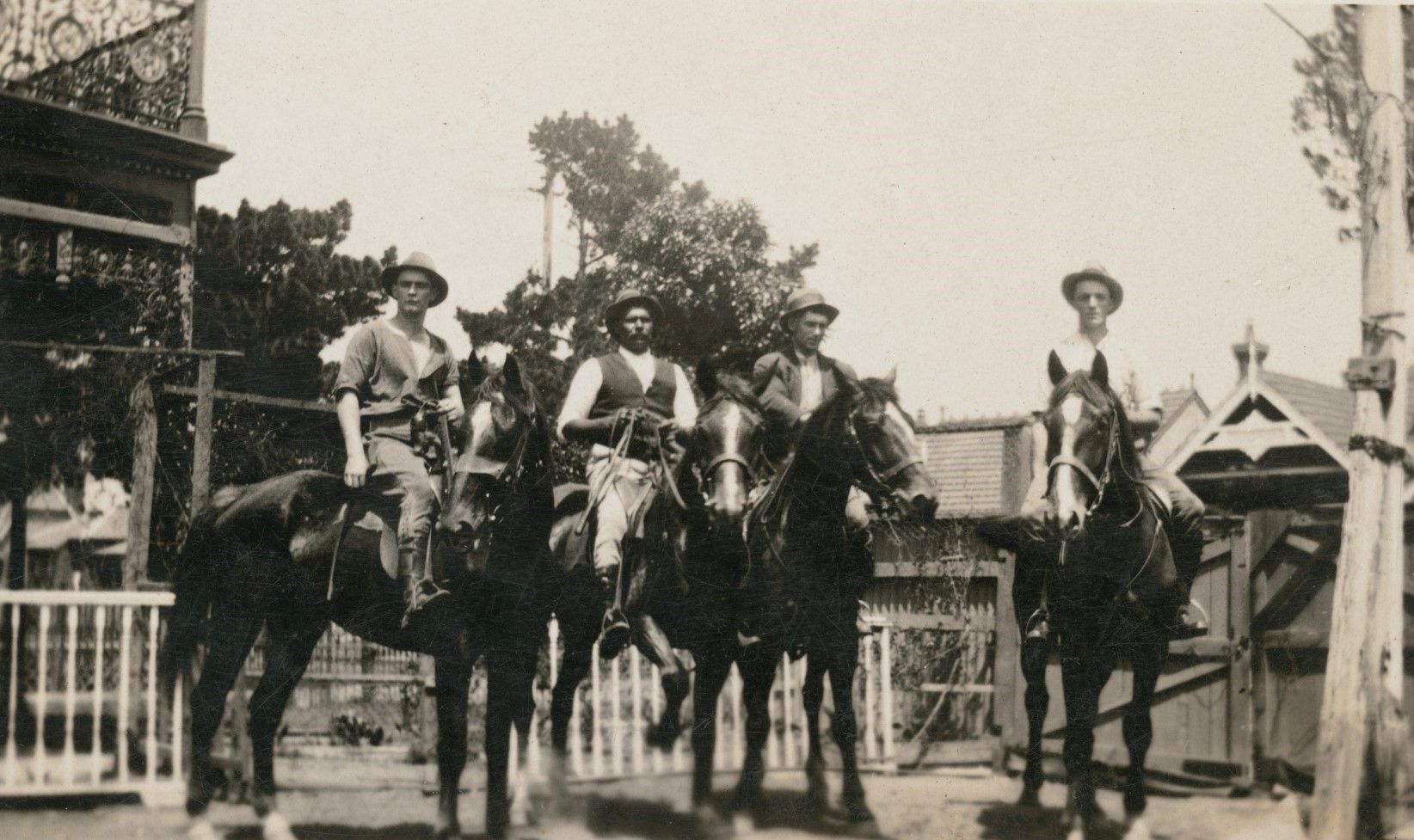Four men on horseback