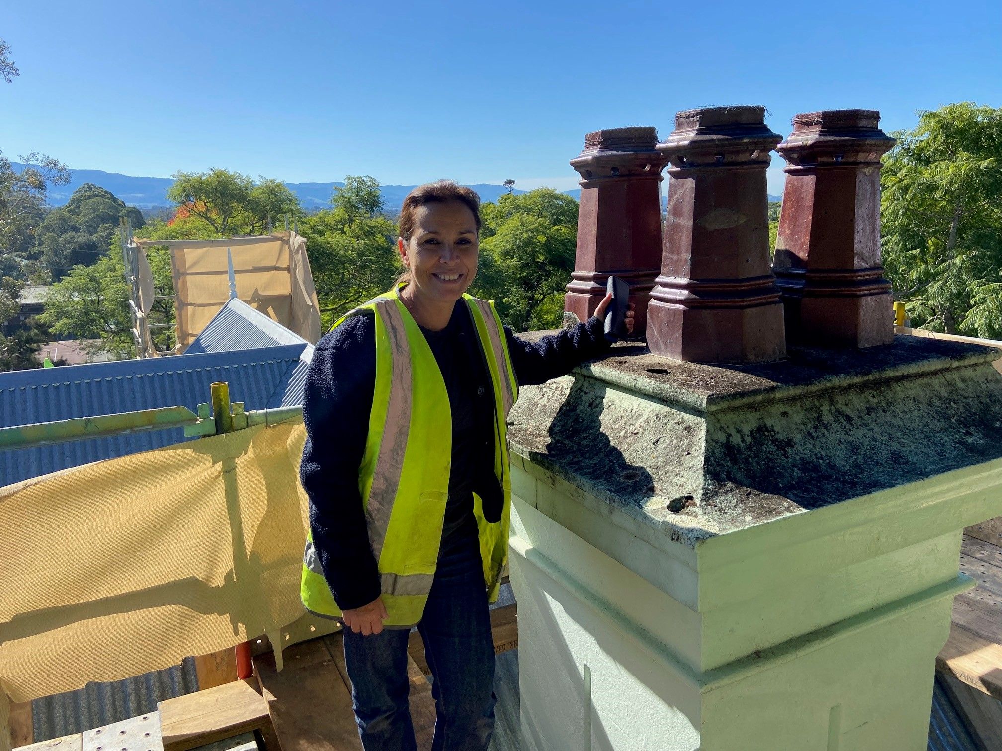 MHNSW Project manager Maria Elena inspecting the Meroogal chimney top