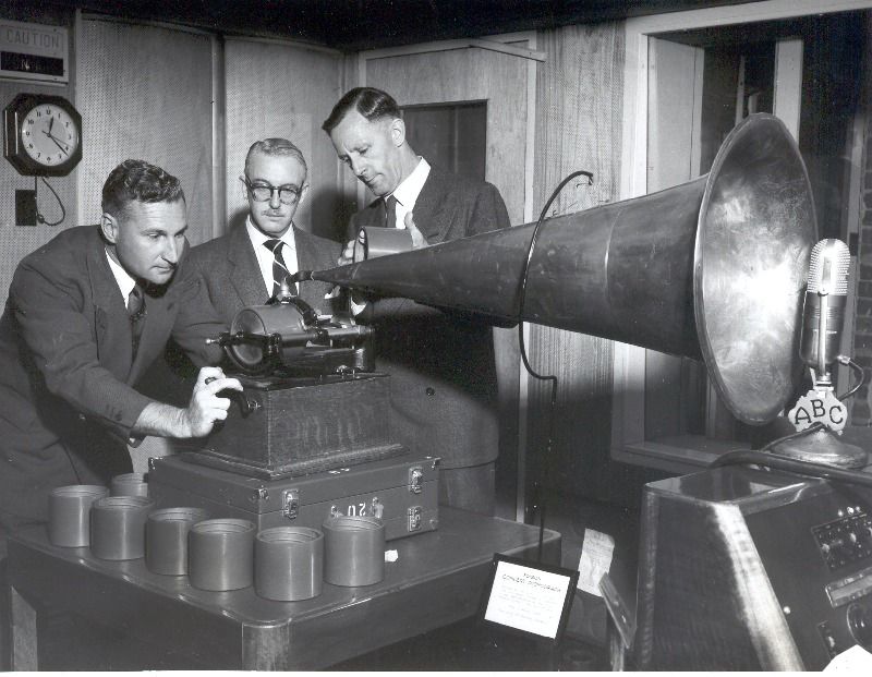 Men playing a gramophone into an ABC microphone