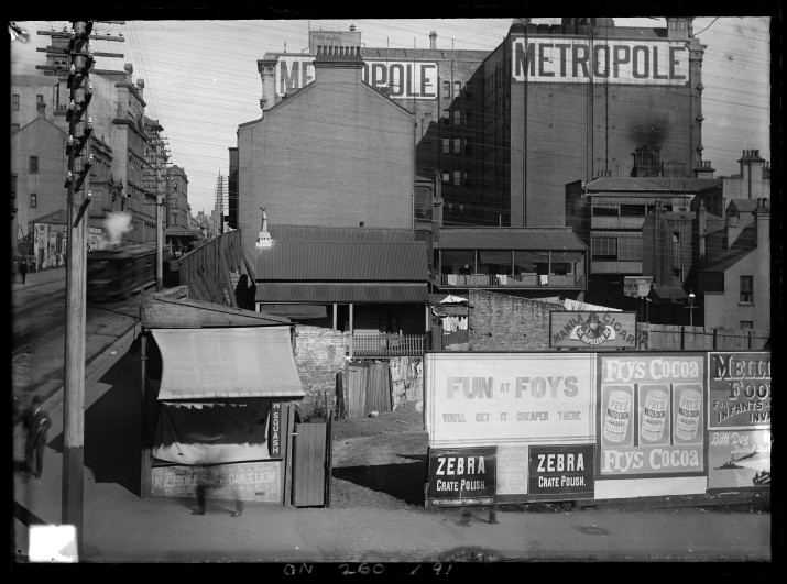 Advertising on the sides of building on a street corner