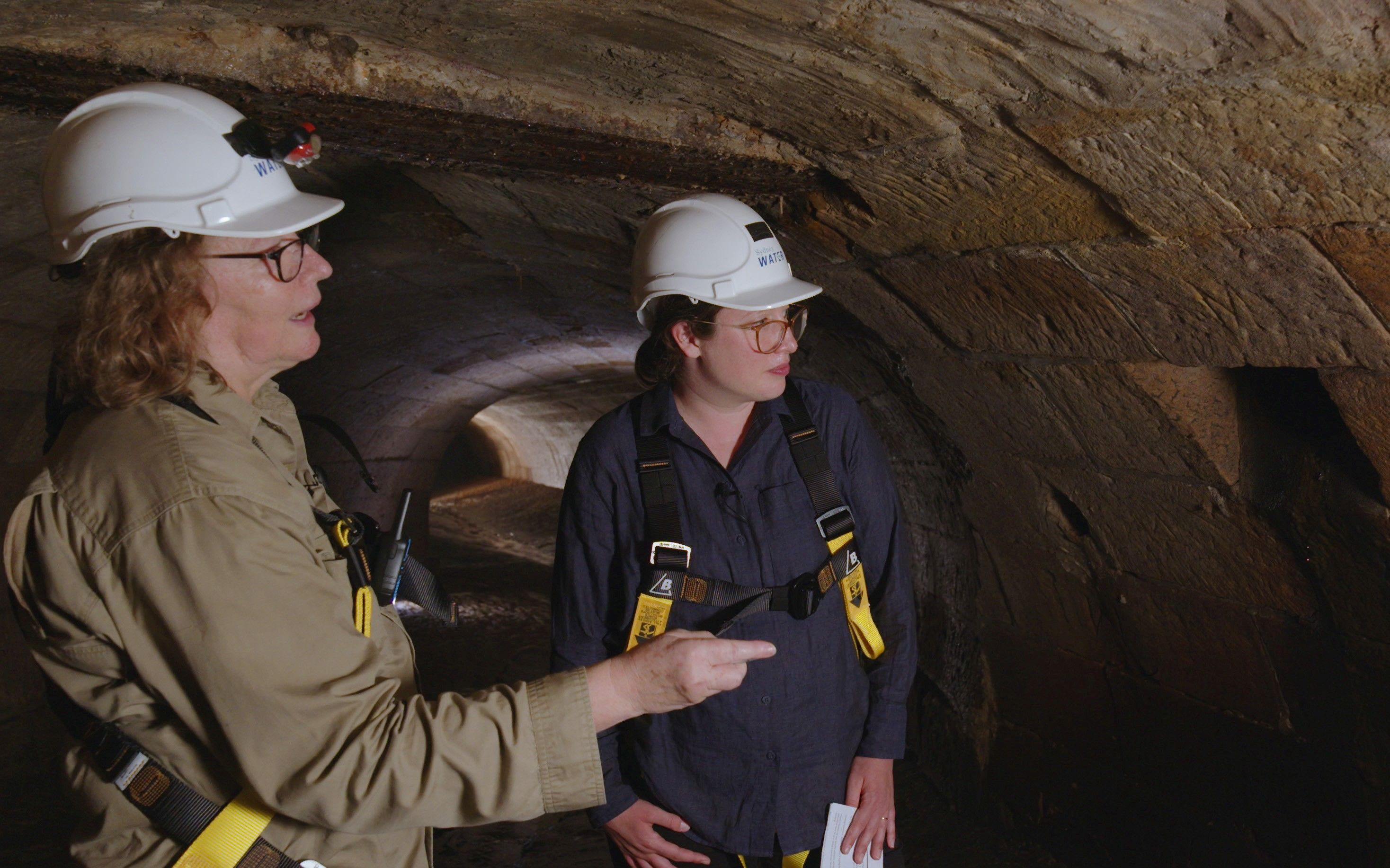 Two people inside the Tank Stream 