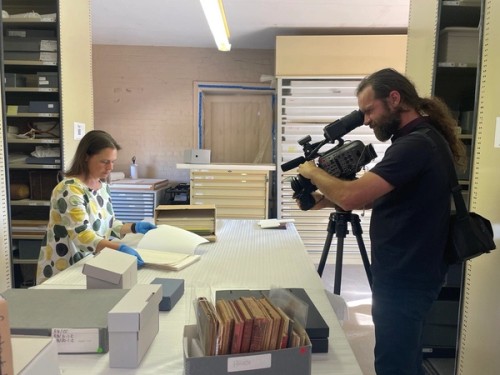 Two staff members filming the second set of videos for the Storyplace Roadshow 