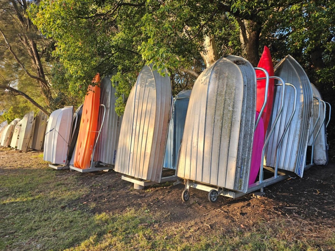 Dinghies stored on portable racks