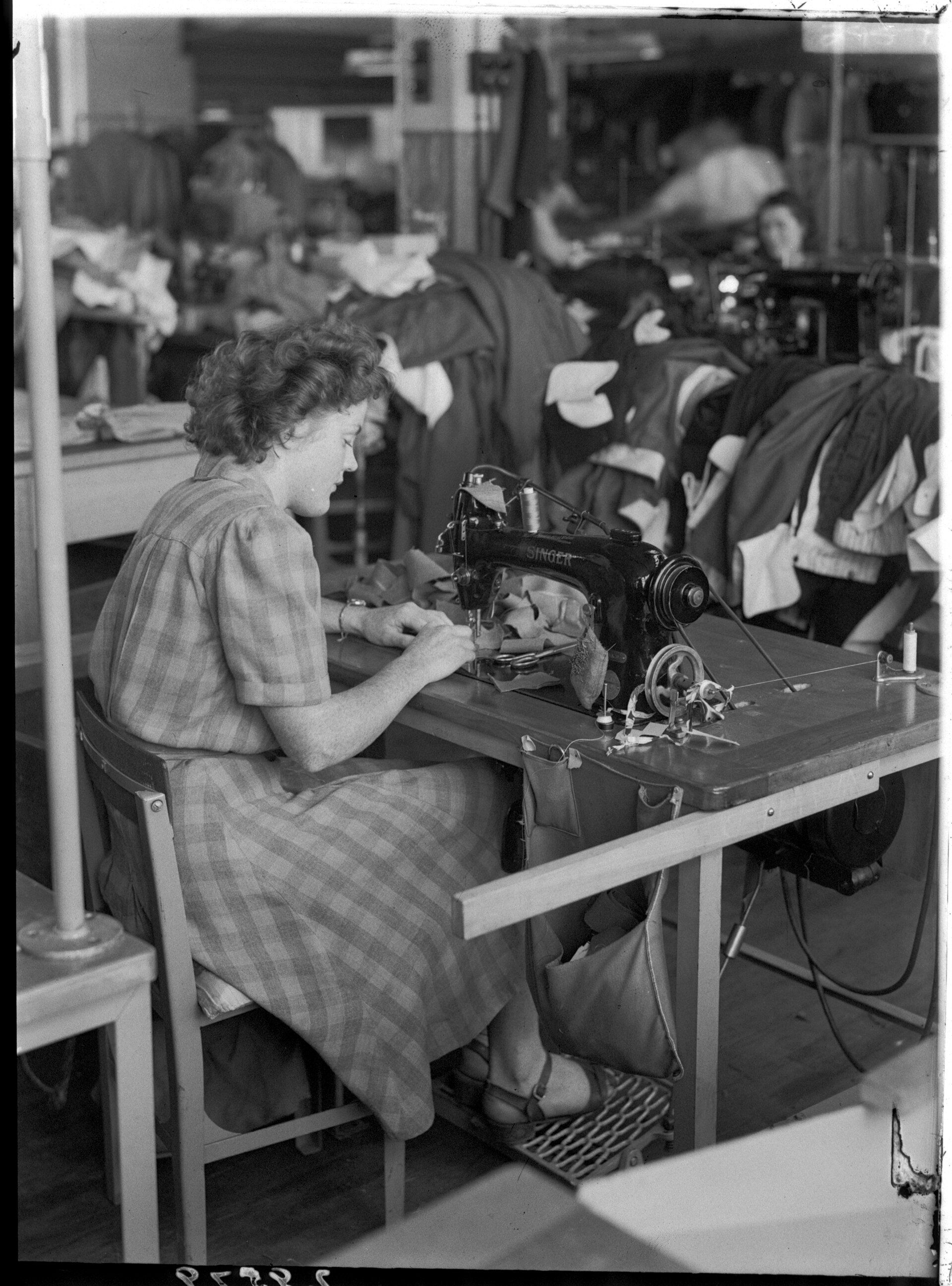 Fabric workshop - woman sewing clothing