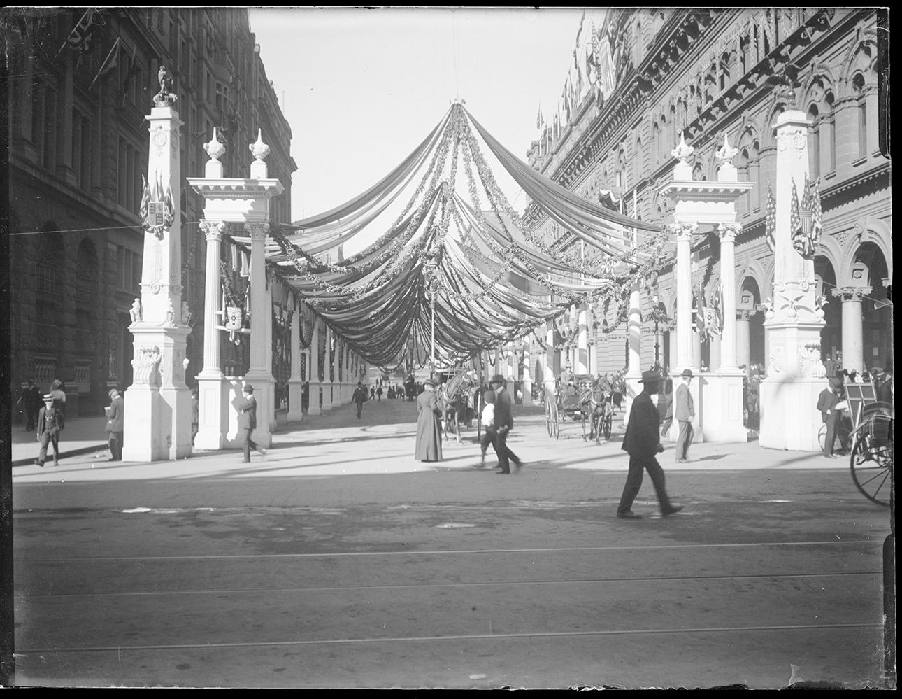 A street view showing decorations and streamers
