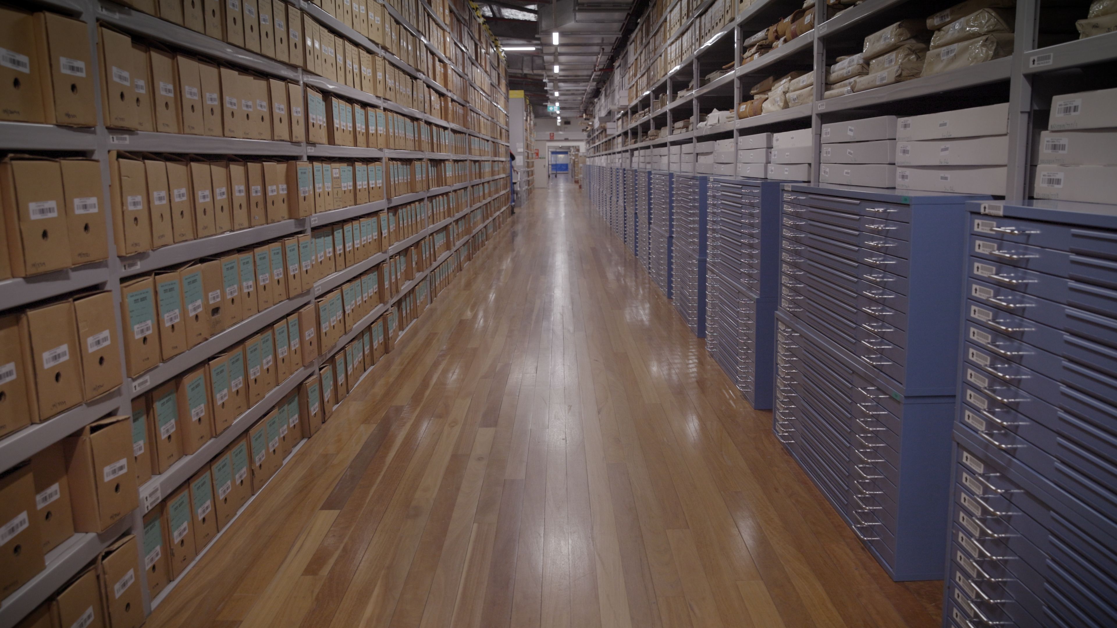 A photo looking down a long row of shelving