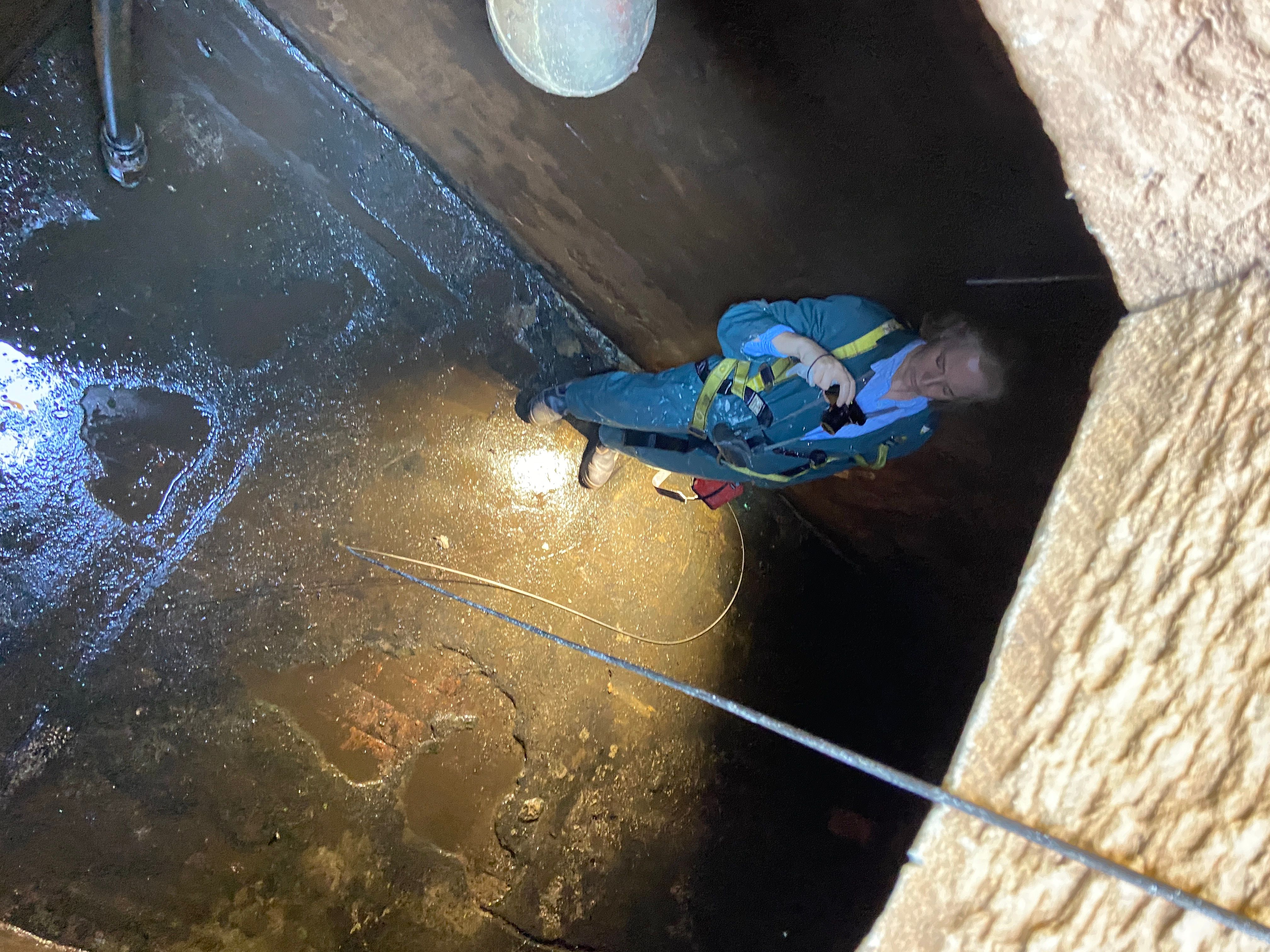 Consultant inspecting the old cistern