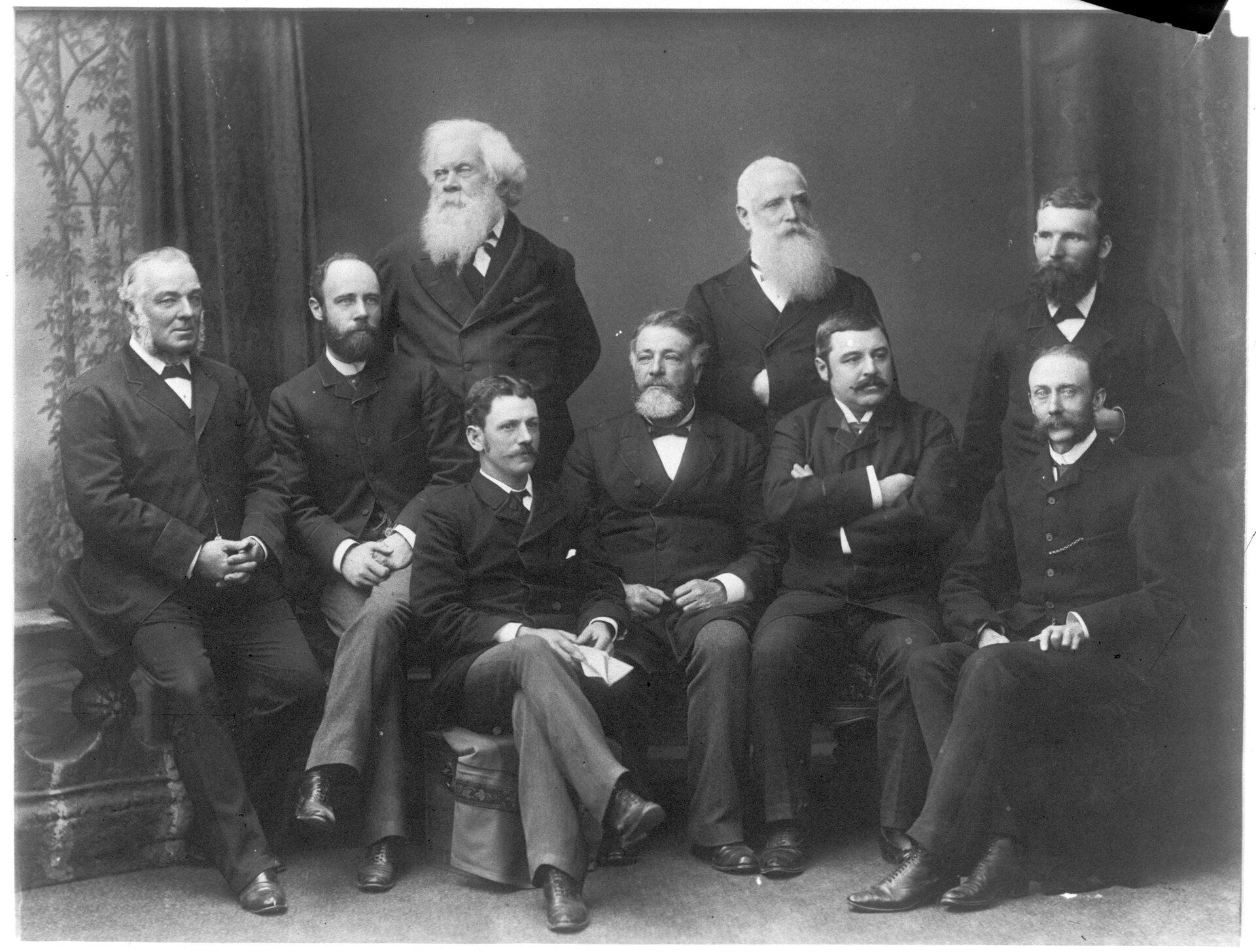 A group photo of men in formal attire 