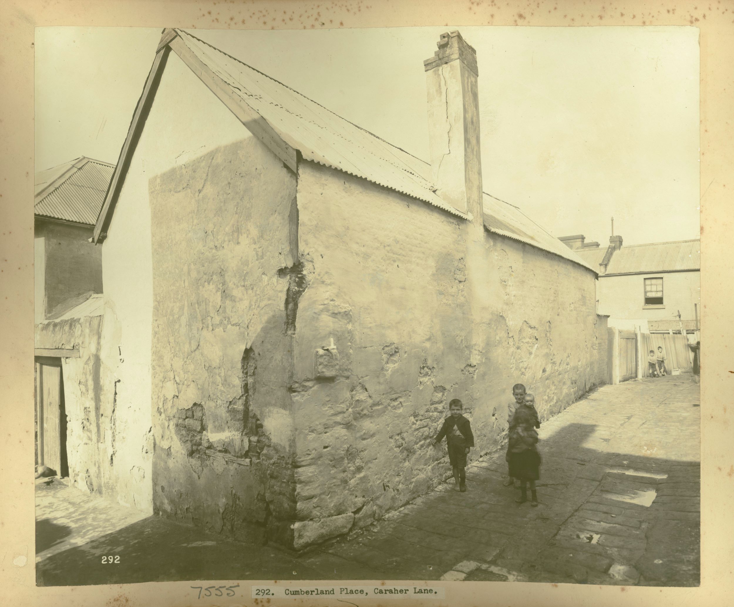 Children stand in a laneway in Sydney