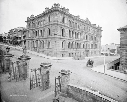 View of a sandstone building on a corner street